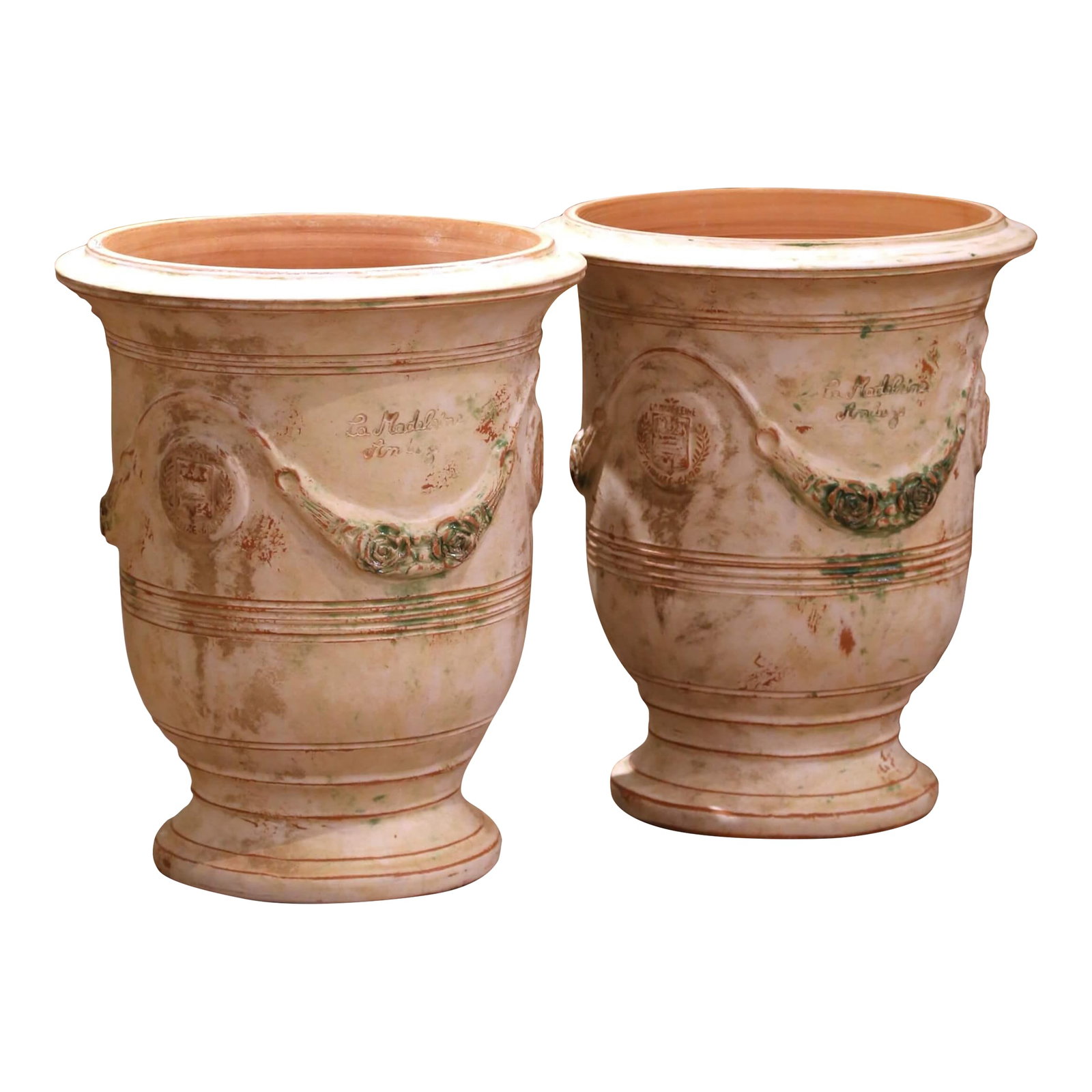 Pair of French Weathered Terracotta Anduze Planters by La Madeleine: Add timeless Provencal elegance to your garden or interior with this pair of handmade Anduze planters by La Madeleine. Crafted in southern France using traditional techniques, each vessel is formed