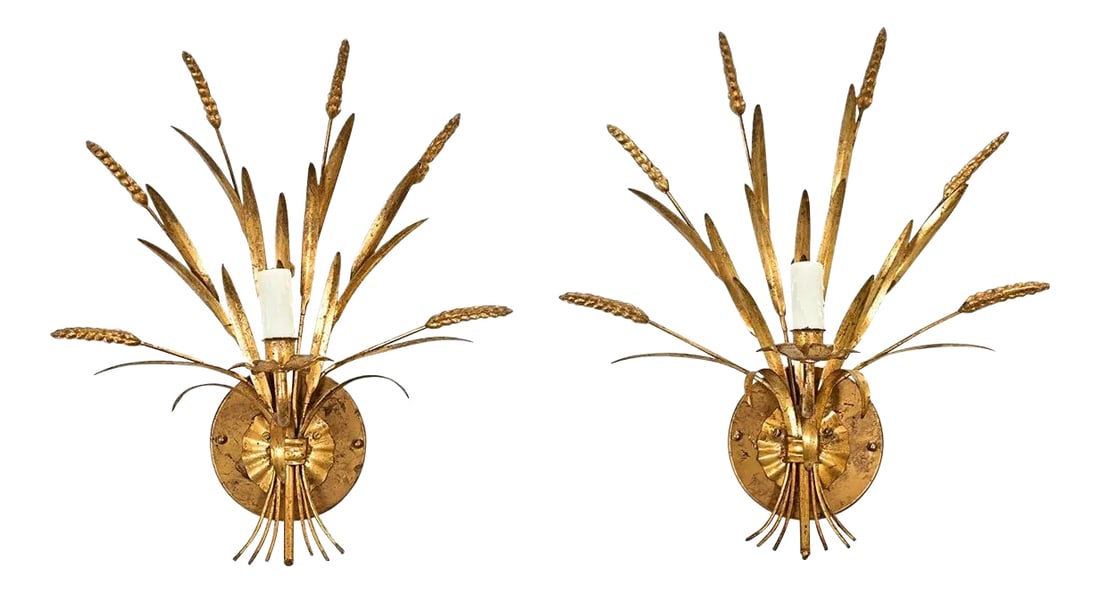 French Pair of Vintage Brass Wheat Sconces: This pair of vintage Hollywood Regency style, French-made gilt sconces use the symbolism of wheat to glamorize the agrarian, promoting abundance and prosperity in any room. The design was likely