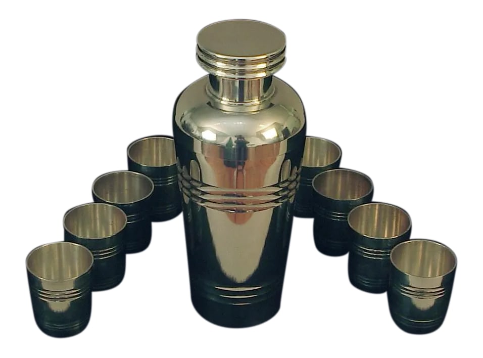 French St. Medard Art Deco Era Silver Plated Cocktail Shaker and Cups - 9 Piece Set: Indisputably an "upper echelon" silversmith, St. Medard's reputation is evident in this exquisitely designed and crafted silver-plated cocktail set. Offering eight "cups" and matching shaker with its