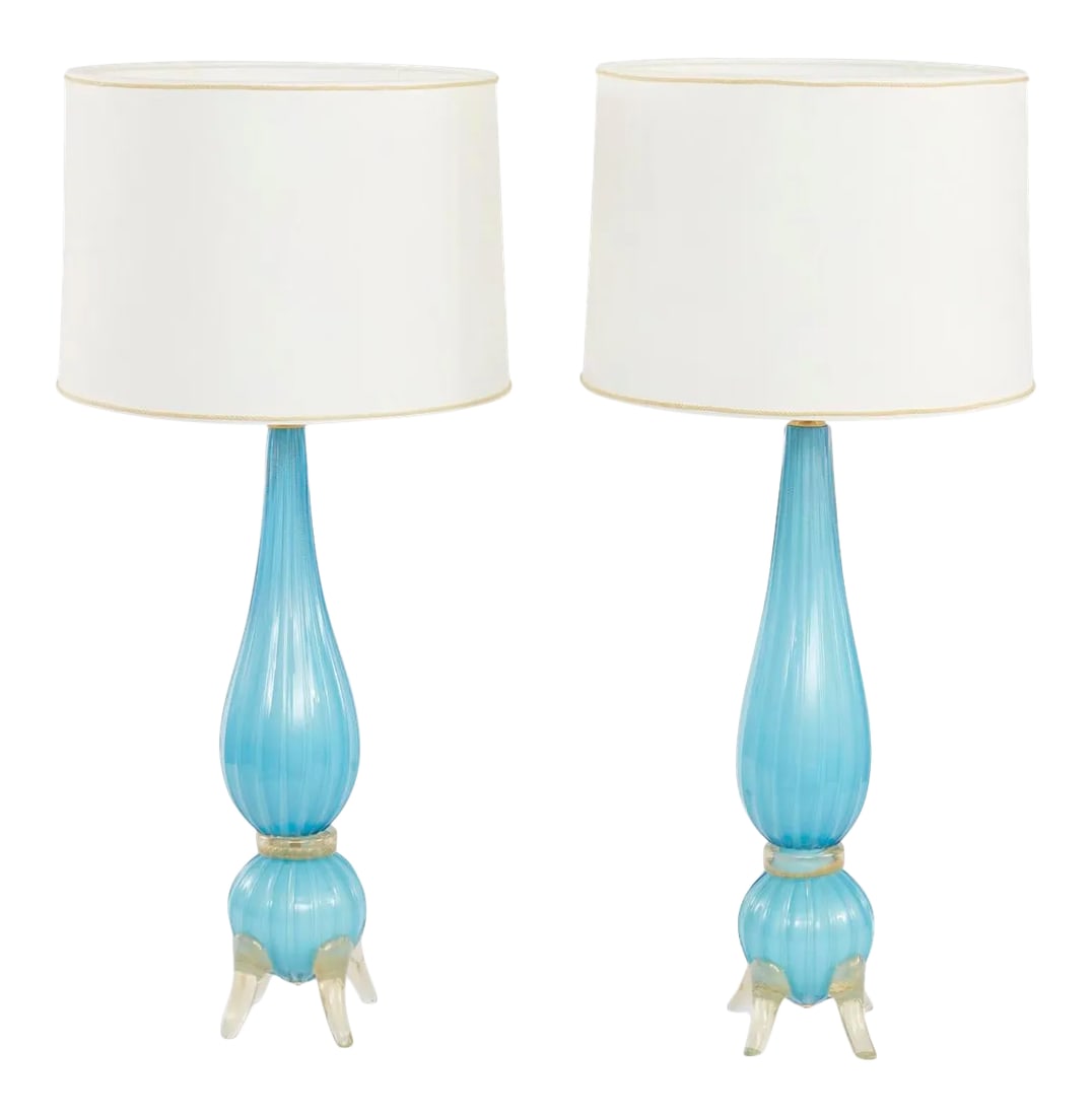 Mid 20th Century Murano Glass Gold Flecks Lamp - a Pair: Mid 20th century Murano glass with gold flecks design details footed pair table lamp. Each lamp is in great working condition. Rewired for US use. Each lamp stands about 26 inches tall x 5.5 inches