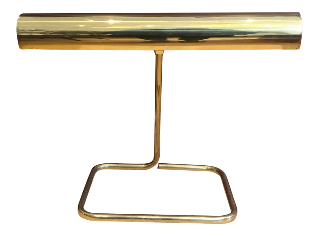 Brass Articulating Koch & Lowy Table Lamp - Mid-Century Modern Icon: Illuminate your space with a true mid-century modern icon. This vintage brass articulating table lamp by Koch & Lowy combines sleek lines with functional beauty. The adjustable arm and pivoting head o