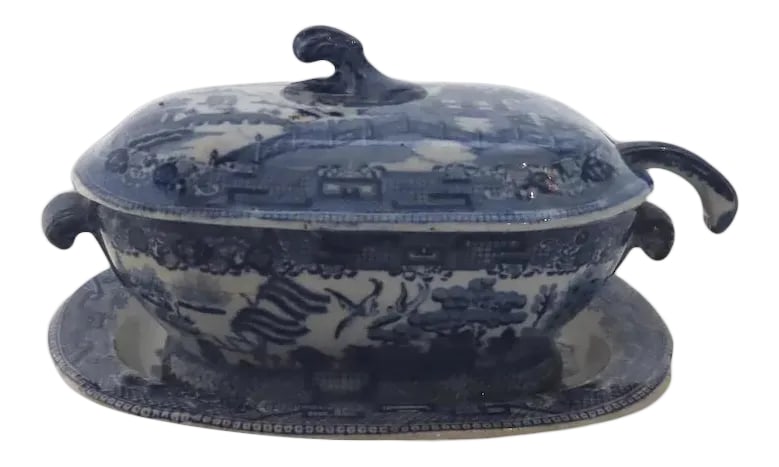 Late 18th or Early 19th Century English Creamware Blue and White Willow Sauce Tureen and Ladle: English early transferware sauce tureen, underplate, lid and ladle. Measures 7" by 5 1/2". Ladle about 7" long. Several marks, not sure all were born together. P.2046 1485 Condition: Alterations:
