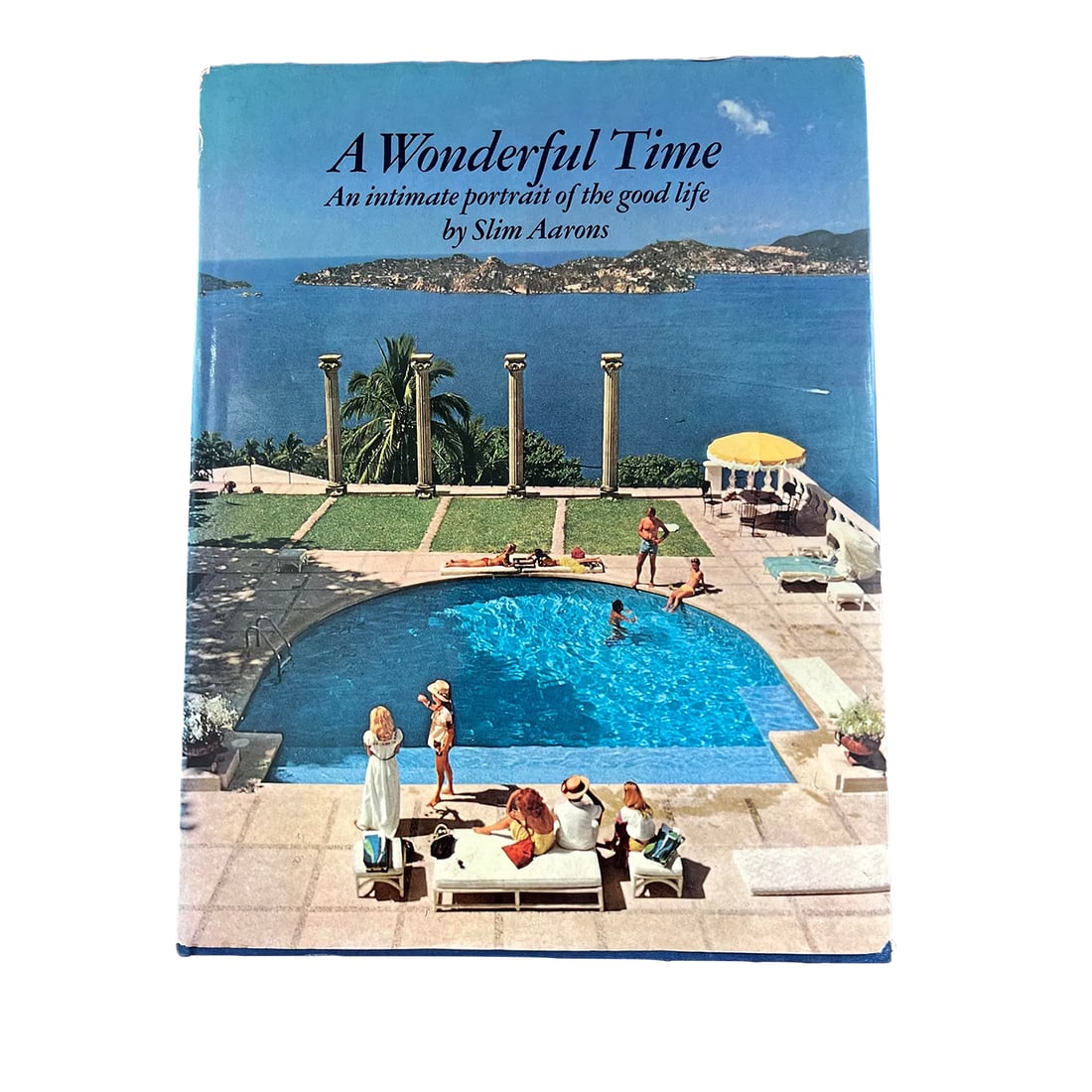 1970s Slim Aarons a Wonderful Time Book (First Edition): The good life... this first edition by famed photographer Slim Aarons captures the essence of lives well lived. Found at an estate in Washington, DC; this books takes the reader back to a different