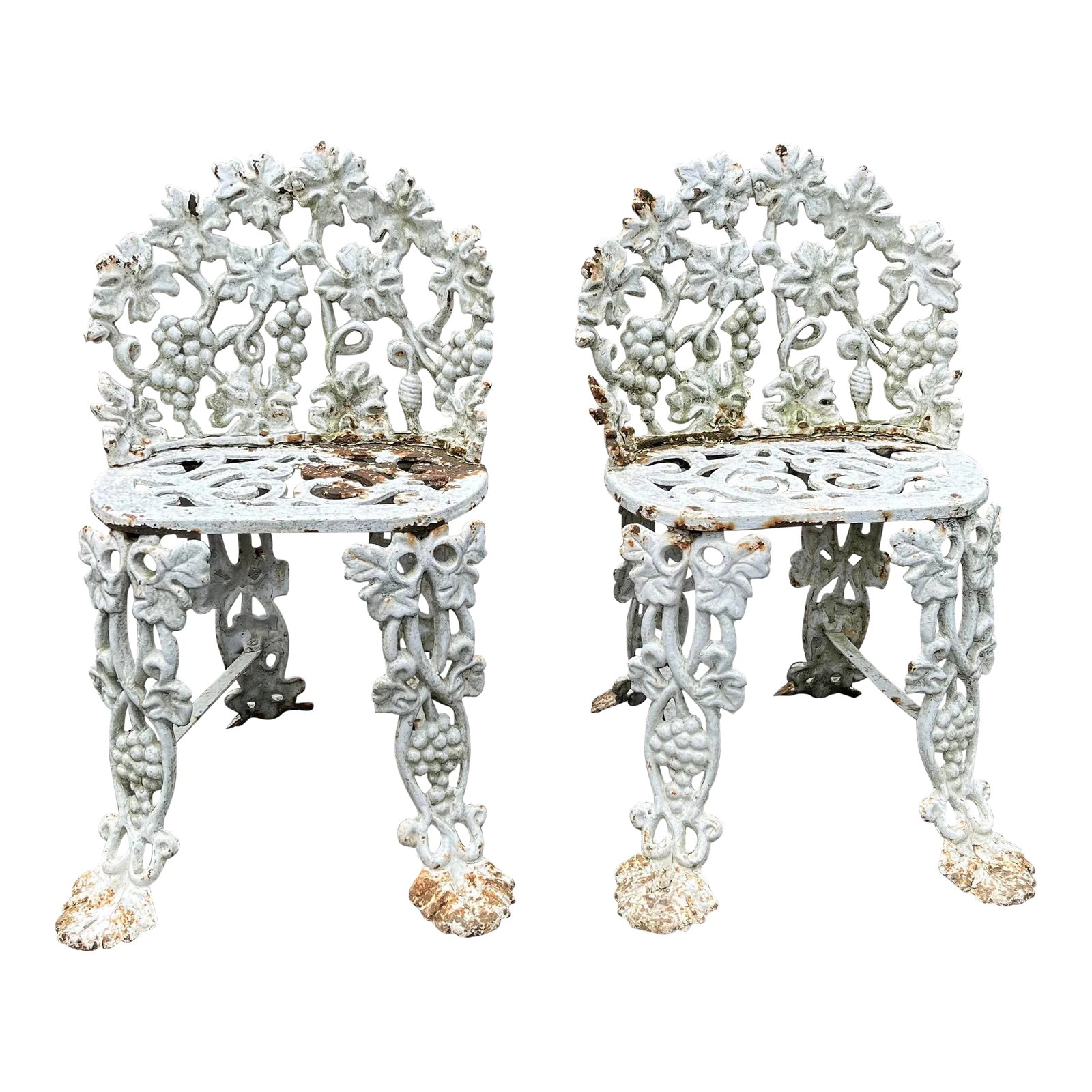 1900s Cast Iron Garden Chairs With Grape Vine Motifs - a Pair: Antique cast iron pair of garden chairs with grape vine motif. Each piece features claw feet and authentic weathered patina. Heavy cast iron pieces. Each seat dimension: 15" w x 9.5" d x 15" h