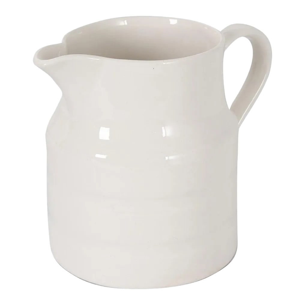 English Early 20th Century Ironstone Dairy Pitcher: A wonderful early 20th century white ironstone pitcher, from Staffordshire, England, circa 1920. Having raised stripes that encircle the vessel, this monochromatic white pitcher will add a touch of