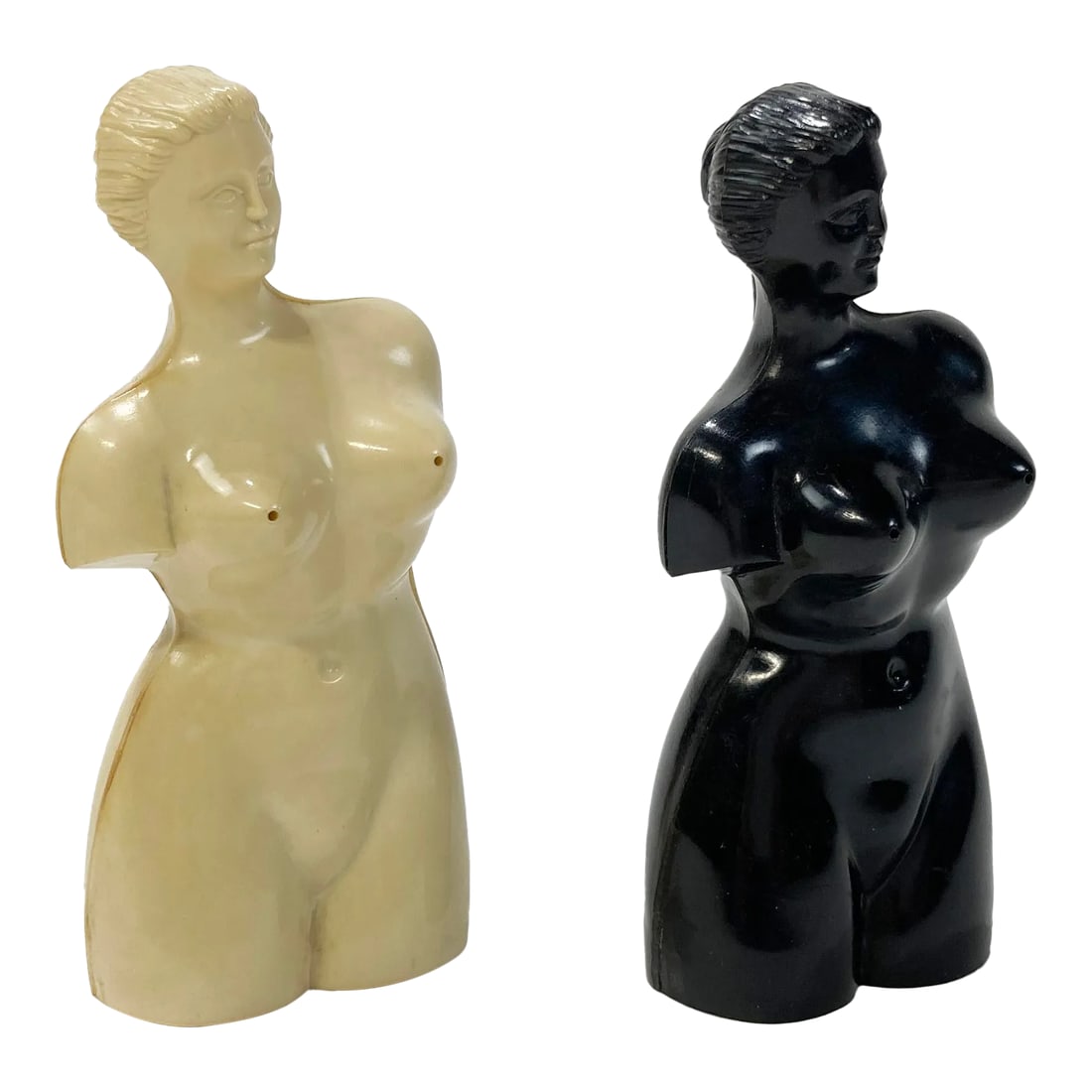 Vintage Resin Female Form Salt and Pepper Shakers, a Pair: Pair of whimsical resin salt and pepper shakers highlighting the female form. One ivory and one black, salt and pepper dispense from bust. These are playful and functional table additions! Minor age