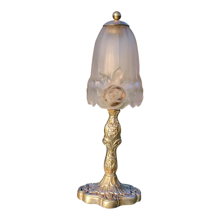 French Art Nouveau Lamp With Glass Shade: The base of this French Art Nouveau lamp is made from nickel-plated bronze and features floral motifs. The glass shade is both frosted and clear to accentuate the floral design. It was made by the