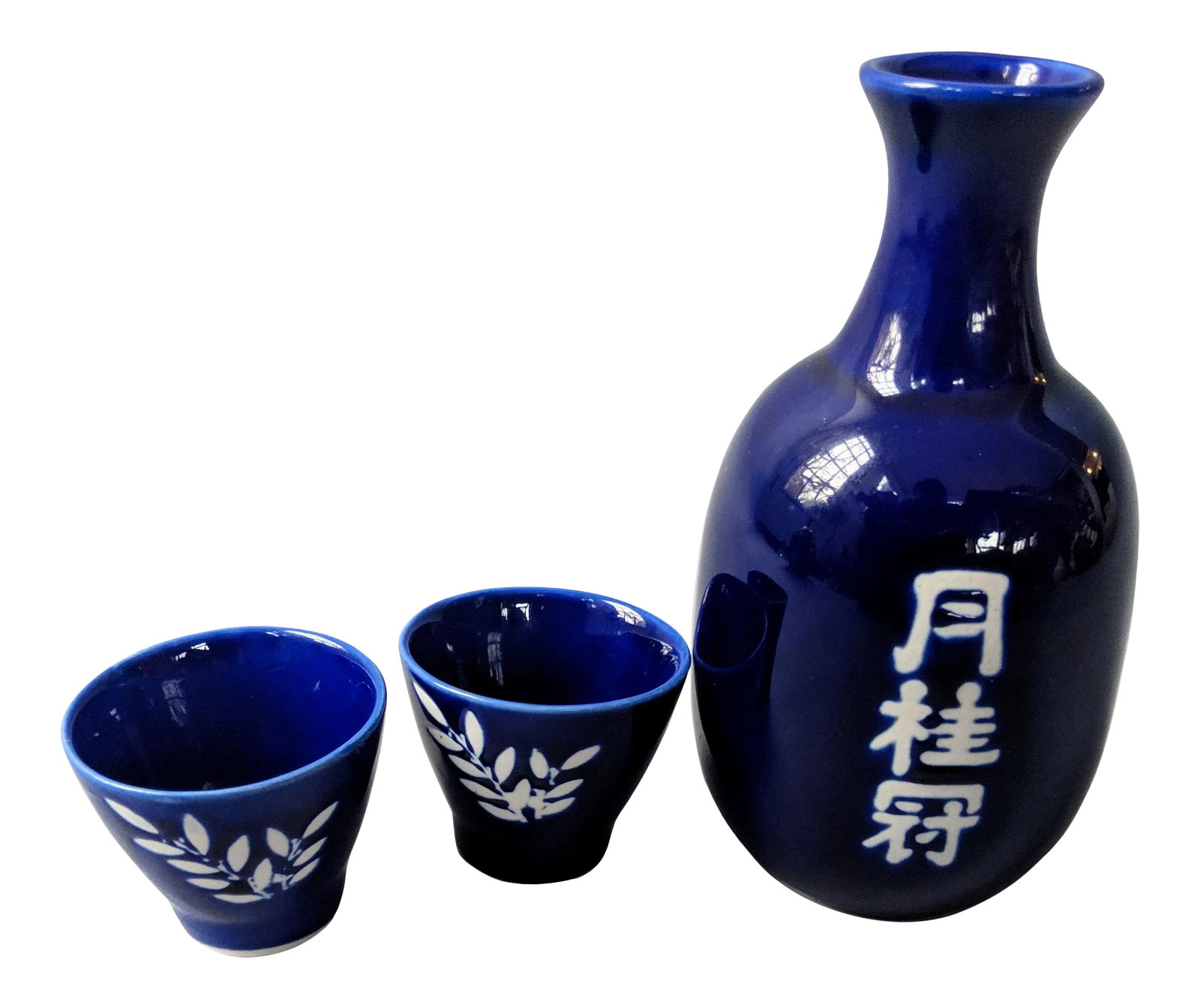 Classic Asian Japanese Blue and White Sake Set - 3 Pieces: This sake set can be either used as a bud vase or as a traditional sake set. This Japanese sake set features one (1) sake pitcher and two (2) cups. The set has never been used but was acquired during