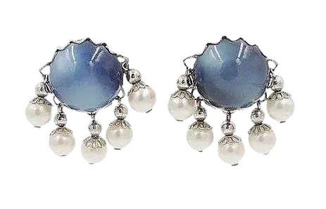 Vintage 1950s Signed Napier Blue Moonglow Faux-Pearl Clip Earrings - 2 Pieces: 1950s silvertone blue moonglow cabochon Lucite and resin-faux pearl dangles clip back earrings. Marked "Napier." Condition: Very Good; minor wear to clips. Measure: 1.38 inches L x 1.38 inches W.