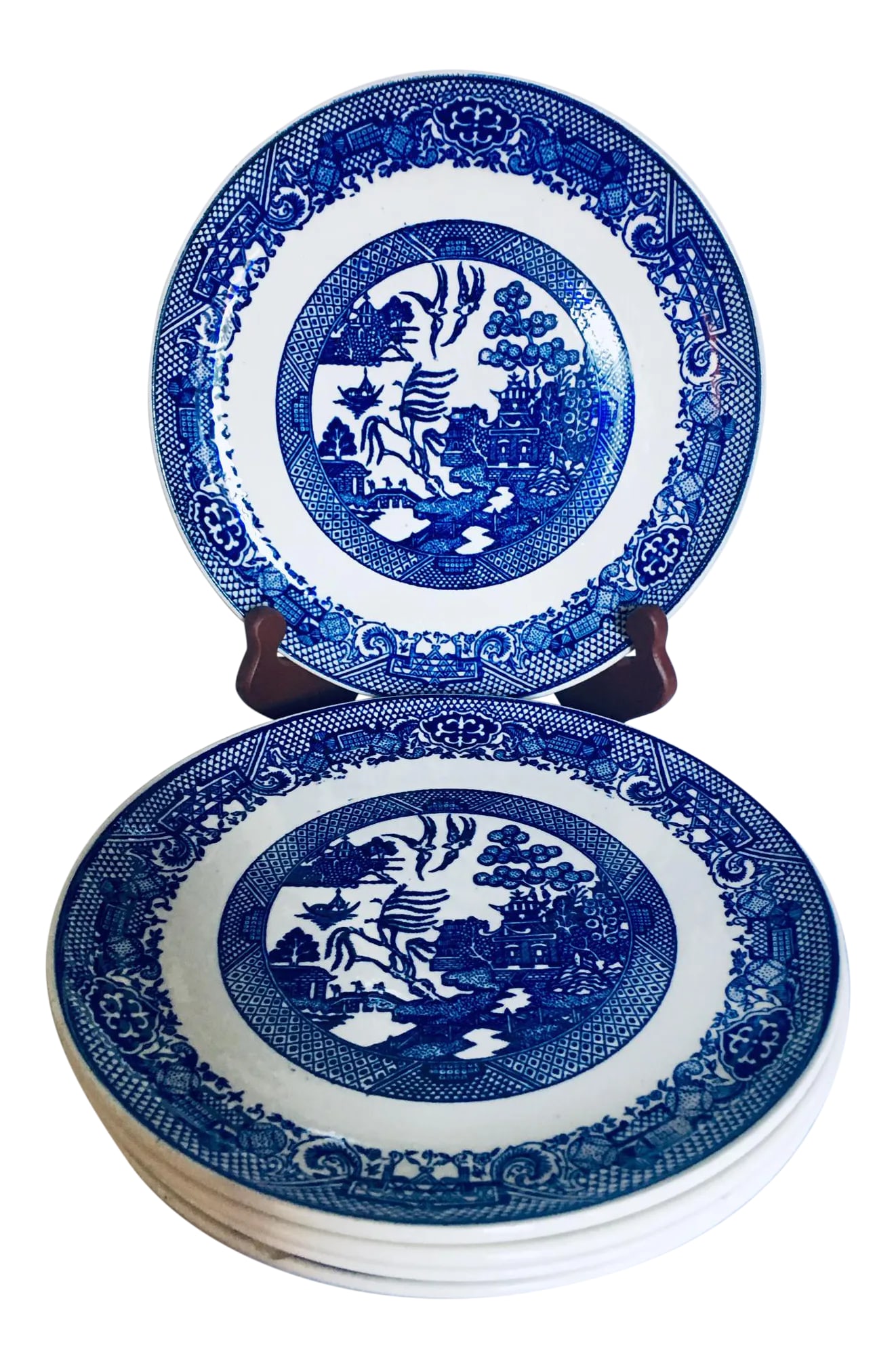 Blue Willow Transferware Plates - Set of 5: This set of five lovely blue willow plates was likely produced in Staffordshire region of England either late in the nineteenth or early in the twentieth century. The traditional design illustrating t