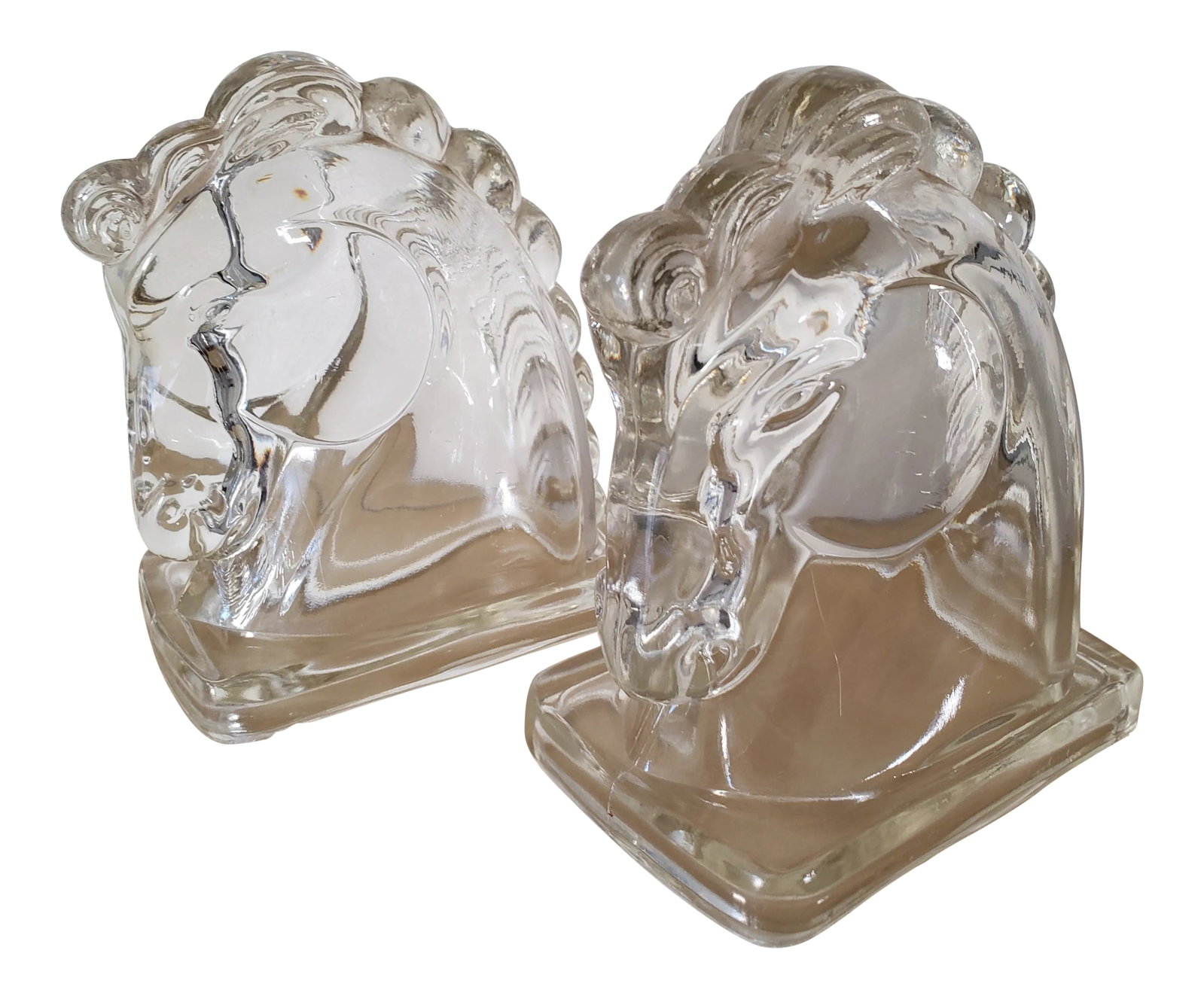 Vintage Glass Horse Head Bookends - a Pair: Pair of beautiful vintage pressed-glass horse head bookends. Hollow as pictured . They can be used for their intended purpose or as design elements that create symmetry. Condition: Alterations: