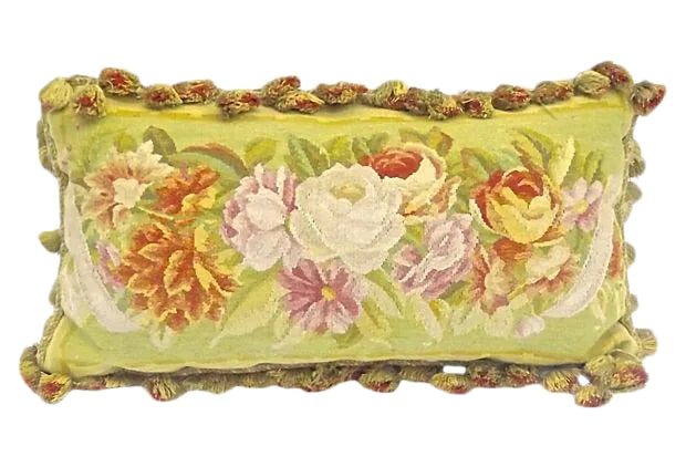 Antique Floral Aubusson Tasseled Pillow: Antique; 1900-1910, French, flora, elongated, Aubusson pillow with floral central design and tassel fringe. Velvet back. Poly fill and zipper closure. Condition: minor wear. Materials: