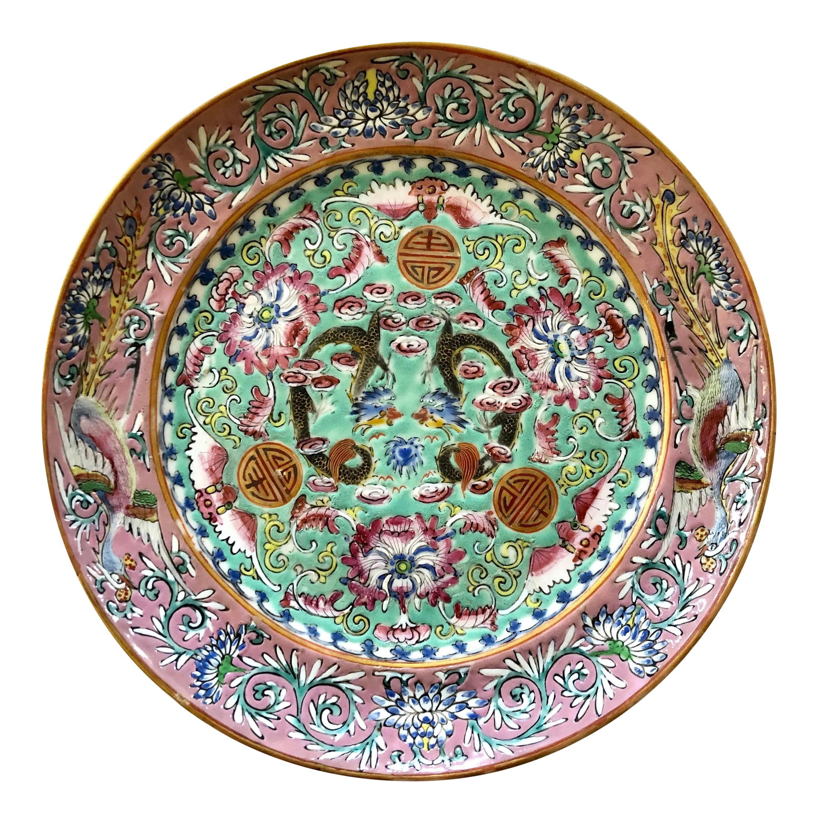 Late 19th Century Chinese Export Plate: This unusual plate has a center field of celadon and a rose boarder. Full of the Chinese motifs of happiness, fortune and luck, are the fish tailed dragons, phoenix, bats, lotus flowers and