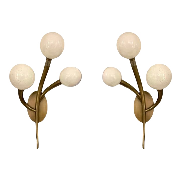 Revelation Modern Cornet Sconces Pair: Stylish Revelation Modern Cornet Sconces Pair, antique brass finish, seeded opal glass, showroom floor samples Condition: Imperfections: Some Imperfections Condition Notes: Showroom floor sample, not