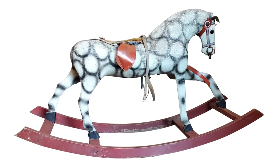 Antique Childs Rocking Horse: A charming and whimsical hand carved and painted wooden and fur fabric rocking horse with untouched, unrestored, elegantly aged patina. Very unique pattern and beautiful complimentary coloring. Circa 