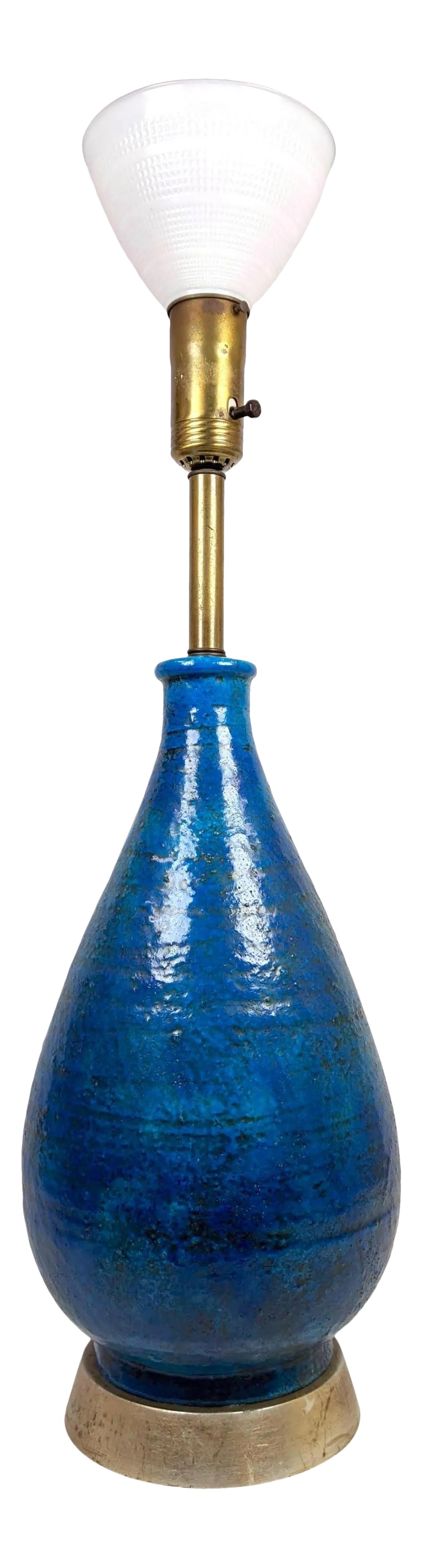 Mid 20th Century Glazed Pottery Monumental Table Lamp After Bitossi: A striking mid century modern glazed pottery table lamp in varying shades of teal and blue with silver leaf wood base and brass hardware in the manor of Bitossi. Circa 1960's Height of lamp to socket