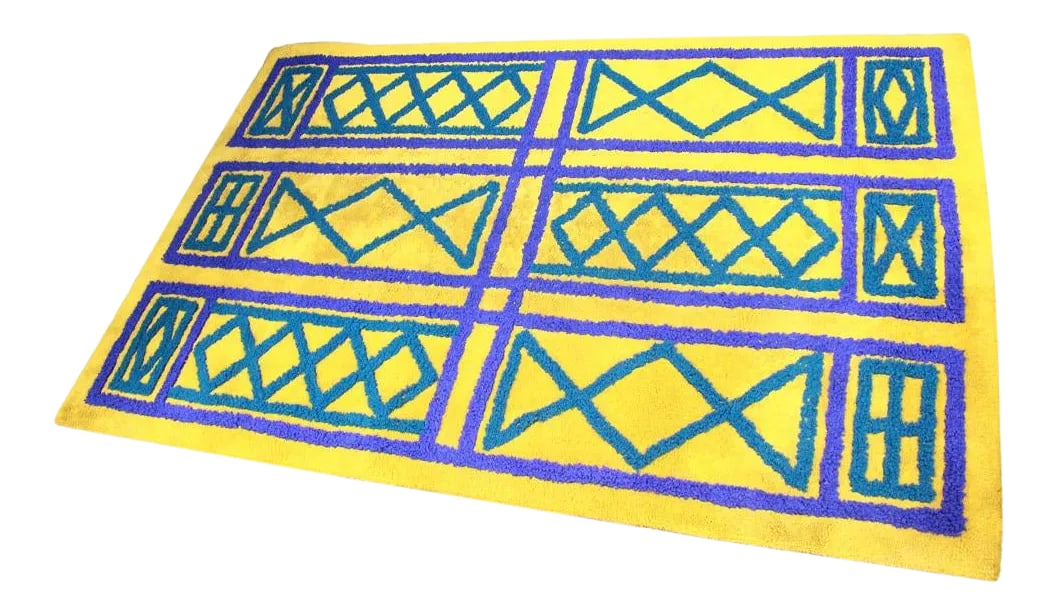 Mid Century Modern Citrus Green and Blue Rug: This beautiful vintage rug comes to you with a vibrant combination of colors. The citrusy green is the perfect complement for the royal blue of the pattern. If you are looking for a pop of color in