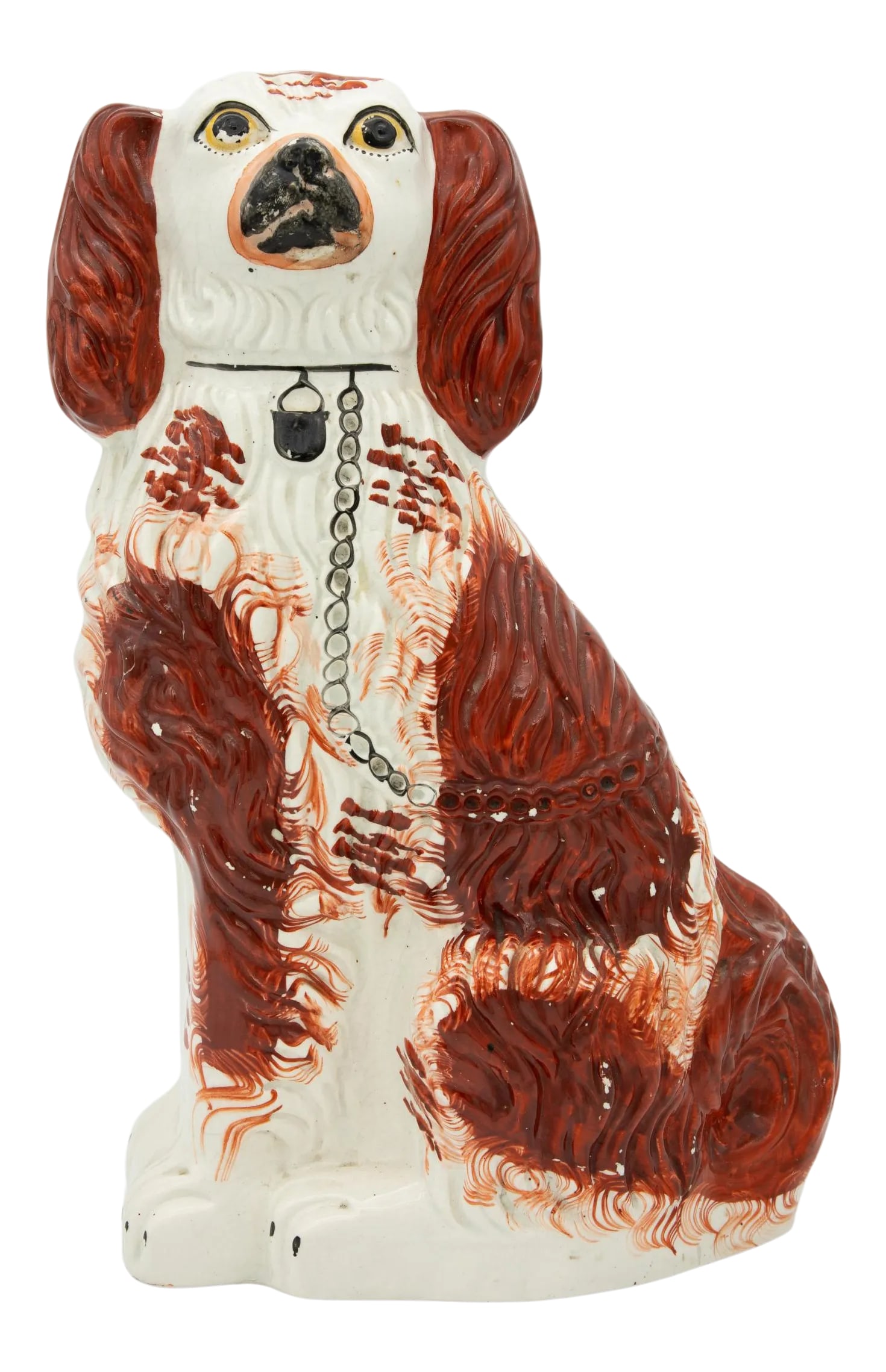 Vintage English Staffordshire Dog: Handsome porcelain ruby Staffordshire Dog, made in England at the turn of the century. Due to its handpainted nature, each dog figurine has a distinct face with expressive eyes and muzzle. The seated