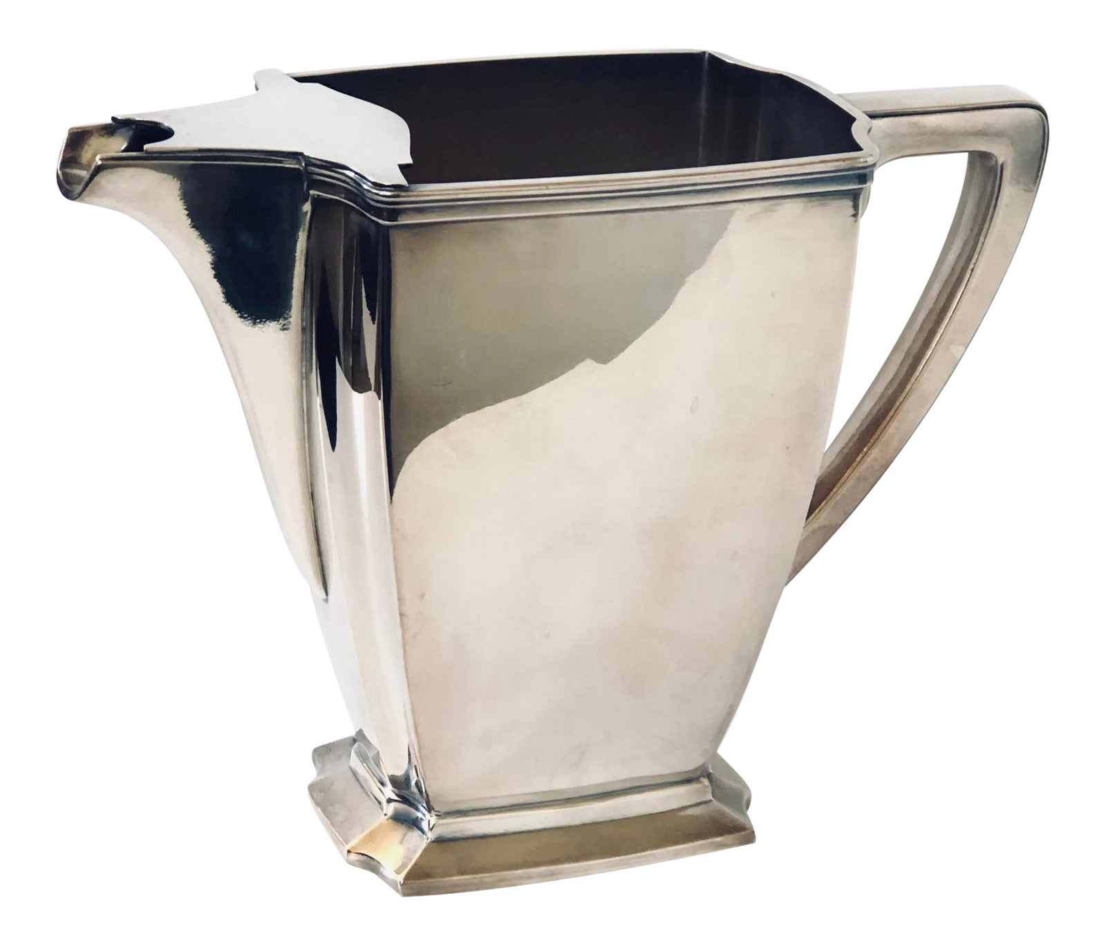 Silver Plate Deco Water Pitcher: Elegant clean lines fashioned this Art Deco water pitcher. Complete with ice trap lip. Upgrade your table or bar with this lovely piece that fits right into contemporary living as well as mid-century