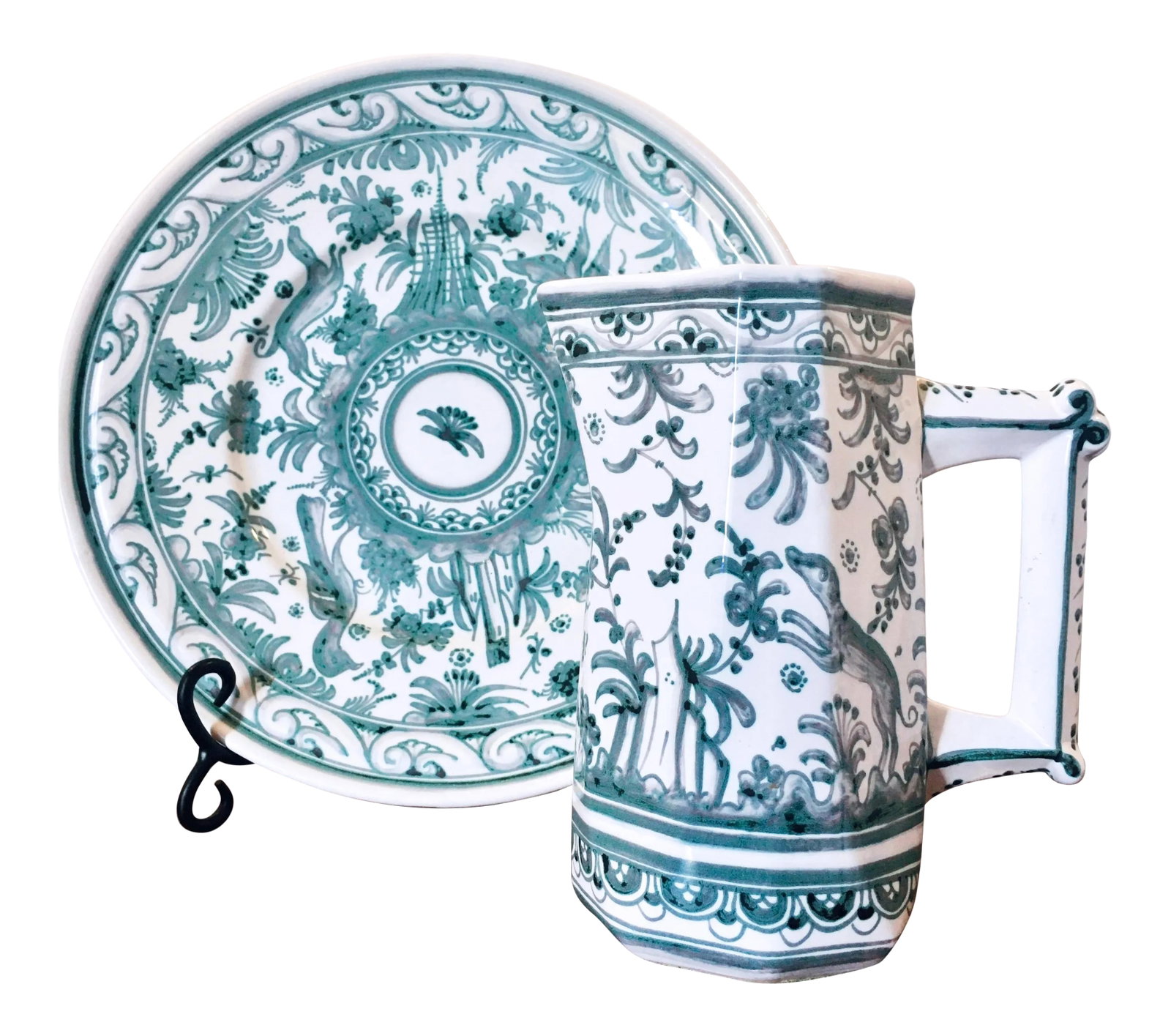 Portuguese Berardos Hand-Painted Charger and Pitcher Set: Vibrant and richly decorated in aqua-tones and crisp white glaze, this pitcher set includes a large plate, pitcher, and metal stand. The scene depicts floral motifs, greyhounds, and other