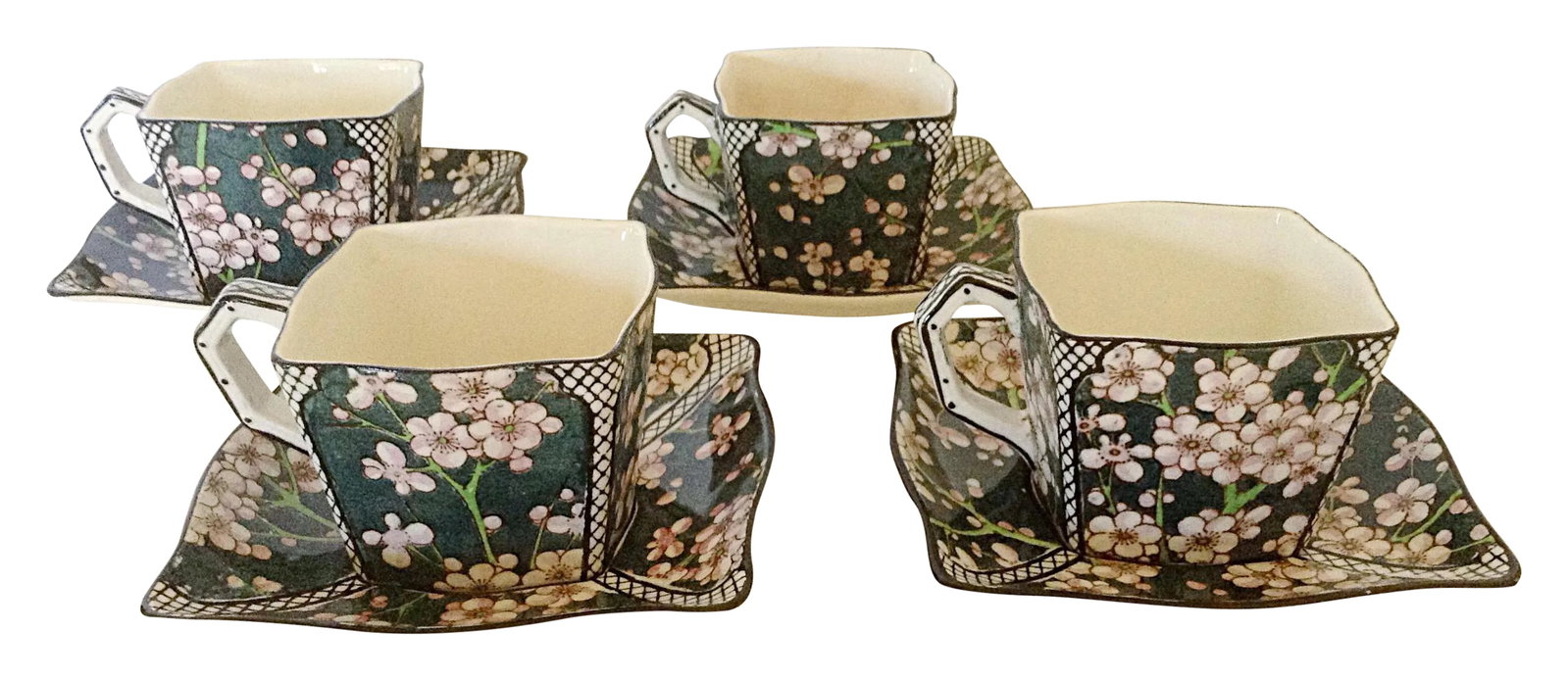 Royal Doulton Cups & Saucers - Set of 4: Unusual set of Royal Doulton cups and saucers each in a square design. All pieces are loving hand painted with a green background and cherry blooms in pink all accented by a lattice pattern on the