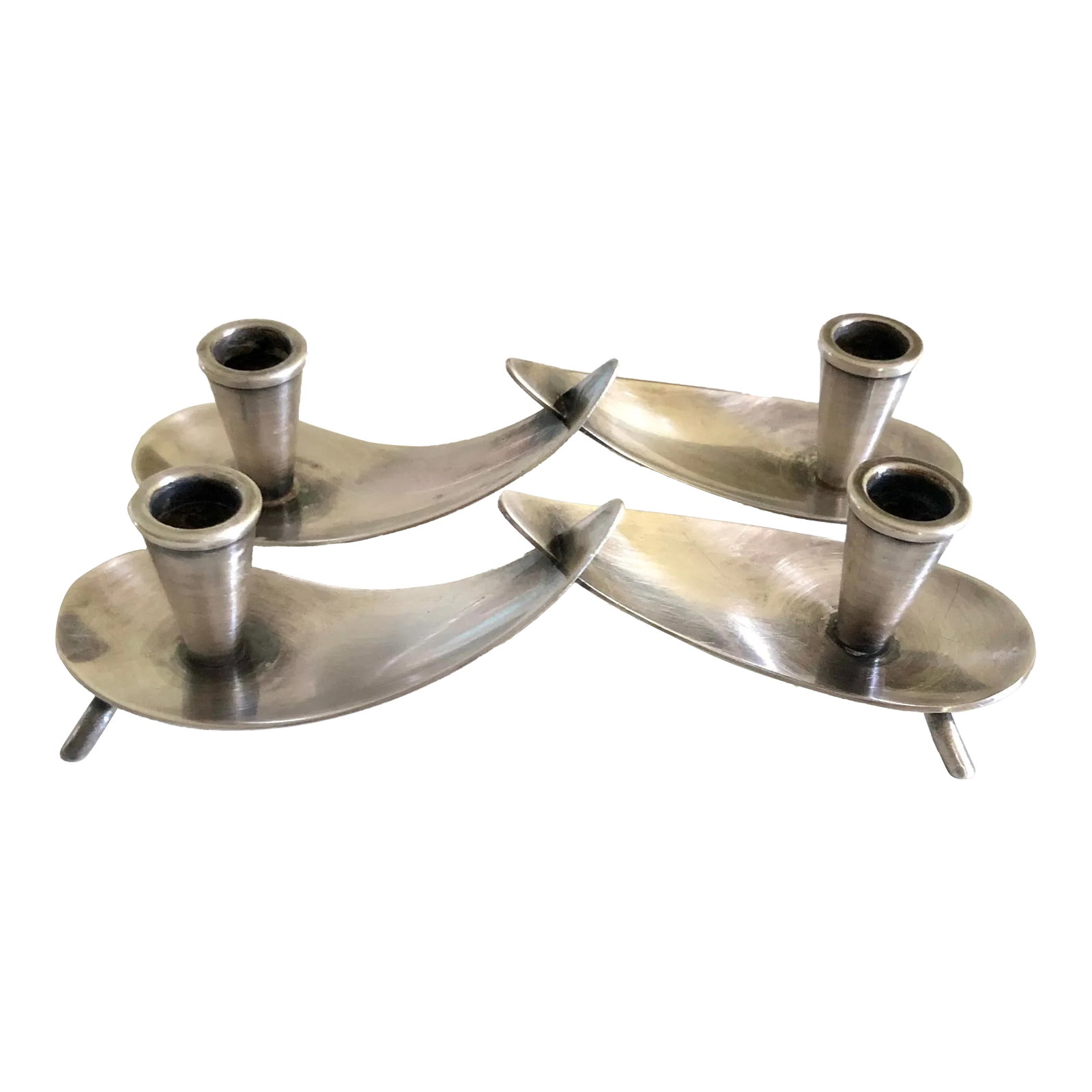 Vintage Danish Modern Carl Christiansen Silver Plate Candle Holder--A Pair: Pair of mid-century modern silver plate candle holders by Carl Christiansen. Sleek biomorphic design, connected at the center. 6" long, 1.5" tall. Candle opening is approximately 0.5" Condition:
