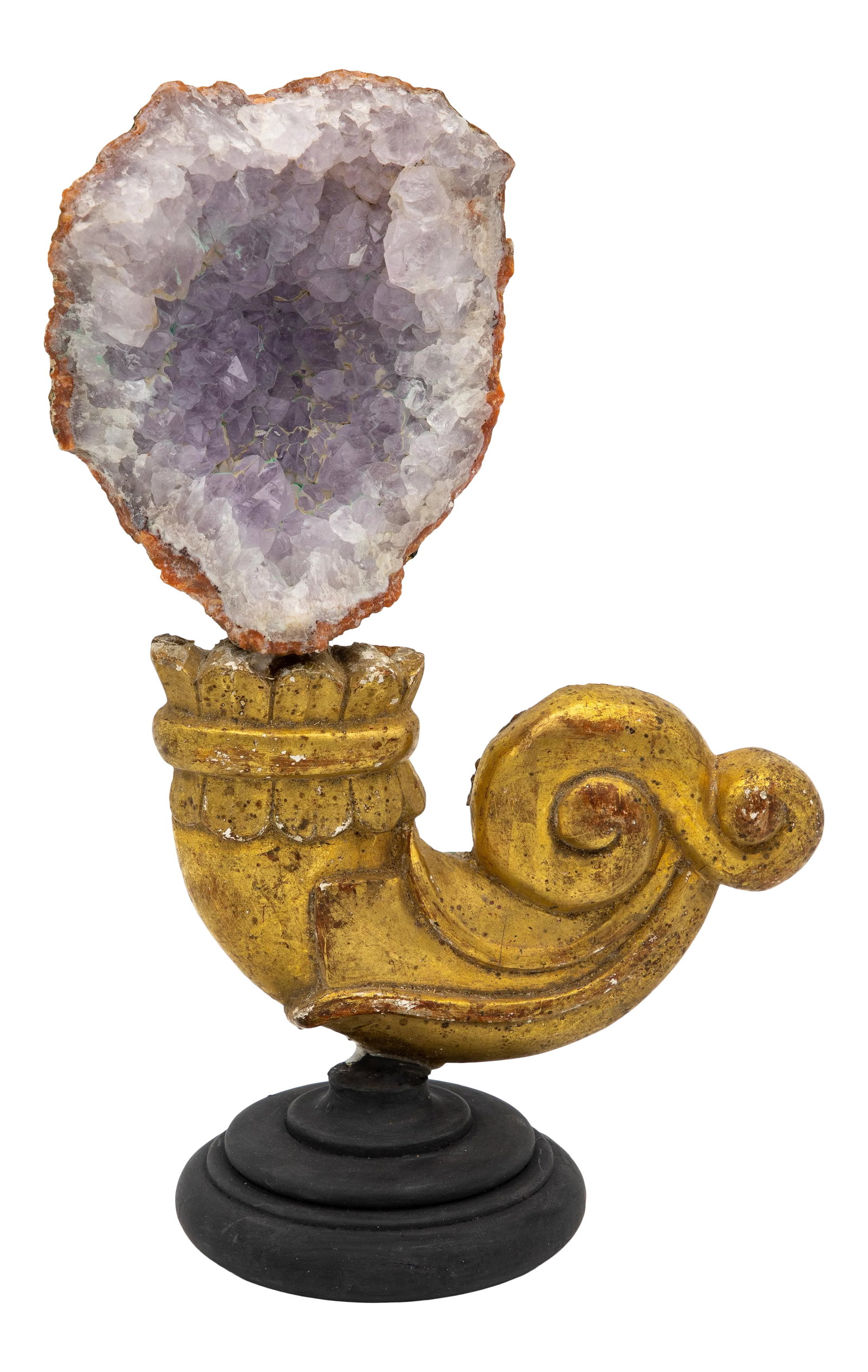 Reclaimed Gilt Fragment With Pale Amethyst: A reclaimed giltwood fragment on a stand. This reclamation art piece is finished with an amethyst at the crown. A lovely combination between the bright gold and the soft amethyst color, this