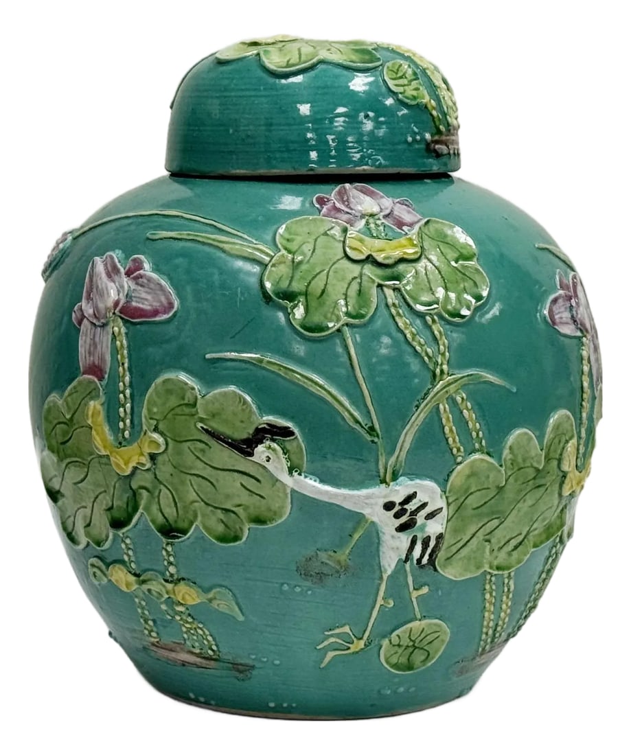 Antique Majolica Style Flora and Fauna Lidded Ginger Jar: Absolutely stunning antique Majolica style turquoise green hand-cast lidded ginger jar featuring vibrant flora and fauna design in raised heron and lily pad scene. Gorgeous detail and color. Age wear
