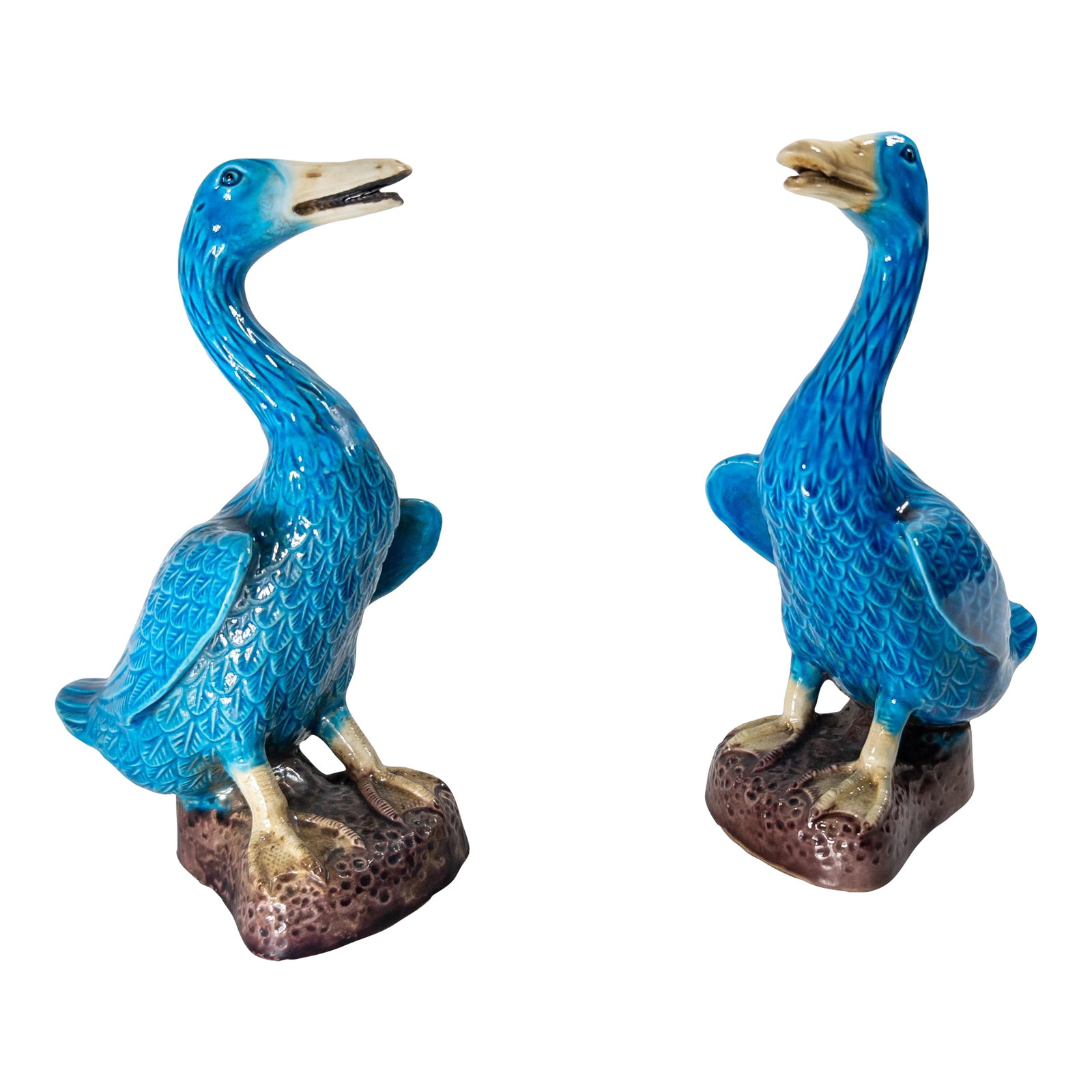 20th Century Pair of Chinese Turquoise Blue Glazed Chinoiserie Ducks or Geese: We are selling this nice decorative pair of Turquoise Blue and Aubergine Purple glazed ducks. These ducks are probably circa 1920-1940 and have great decorative presence. These models have open mouth