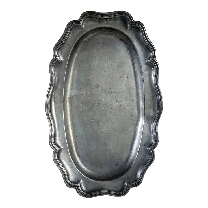 Large French Pewter Reeded Oval Fish Platter: DETAILS An antique serpentine and reeded rim oval pewter platter or tray from France. MARKS Stamped: maker's touchmark with IOB and fleur-de-lys. PERIOD Early 19th century DATE Circa 1800 DIMENSIONS