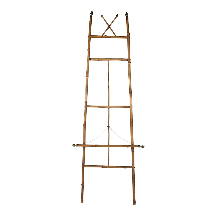 1960s Bamboo Floor Easel: Bamboo easel with acorn brass end caps and chair. Dimensions are largest measurements when extended. Condition: Alterations: Original Condition Unaltered Imperfections: Some Imperfections Condition