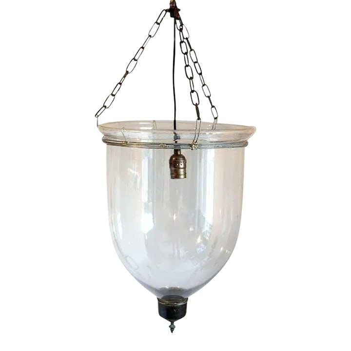 English Regency Style Glass One-light Hall Lantern: This antique hall light features a clear blown glass bell with glass terminal, all suspended by a metal collar, chains and glass smoke cap. Originally used for candles, this fixture was recently
