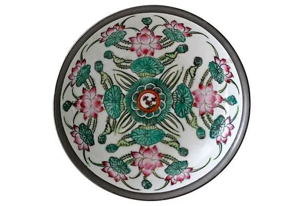 Encased Porcelain Floral Dish: A lovely encased dish. Features a floral scene with turquoise, greens and pinks. The silver encasing has a beautiful patina, with no chips or scratches to the porcelain. It is marked on the bottom: