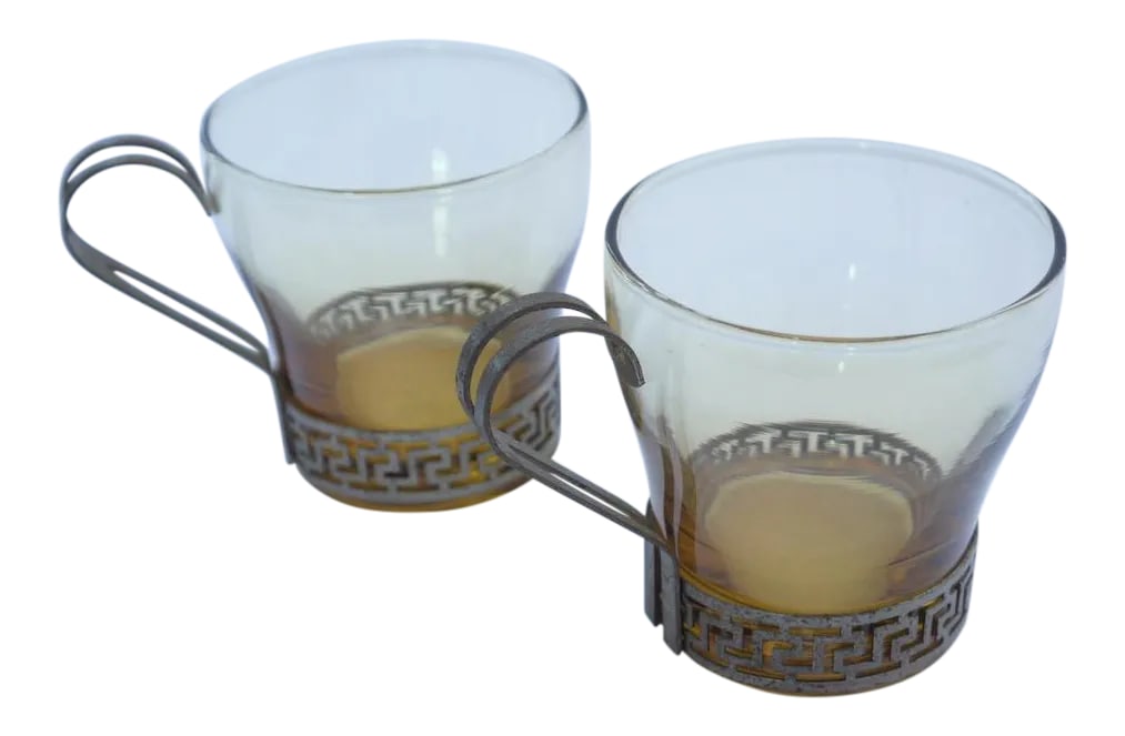 Art Deco Greek Key Coffee Cups - A Pair: This set contains a pair of smokey glasses framed with metal key pattern around base and handle. Art Deco pair are in great condition, metal slightly aged, but is inline with age of glasses.