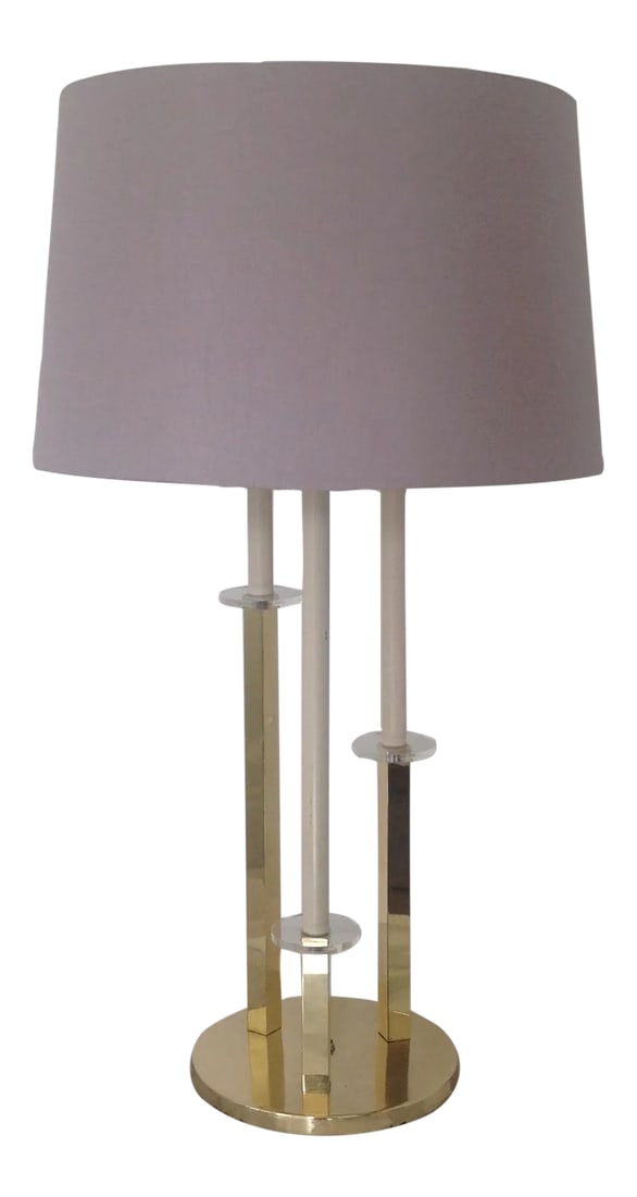 Hollywood Regency Style Brass & Lucite Table Lamp: Hollywood regency style brass plated and lucite Table Lamp. Good working condition with original parts. Minor wear consistent with age and history. Some scratches and discoloration on the brass base.