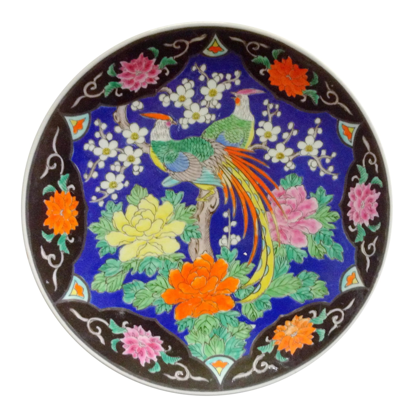 Japanese Birds & Cherry Blossom Charger: This striking Japanese charger is decorated with a pair of beautiful birds resting atop a branch with peonies below and cherry blossoms surrounding them. The bright blue sky is accented by a black