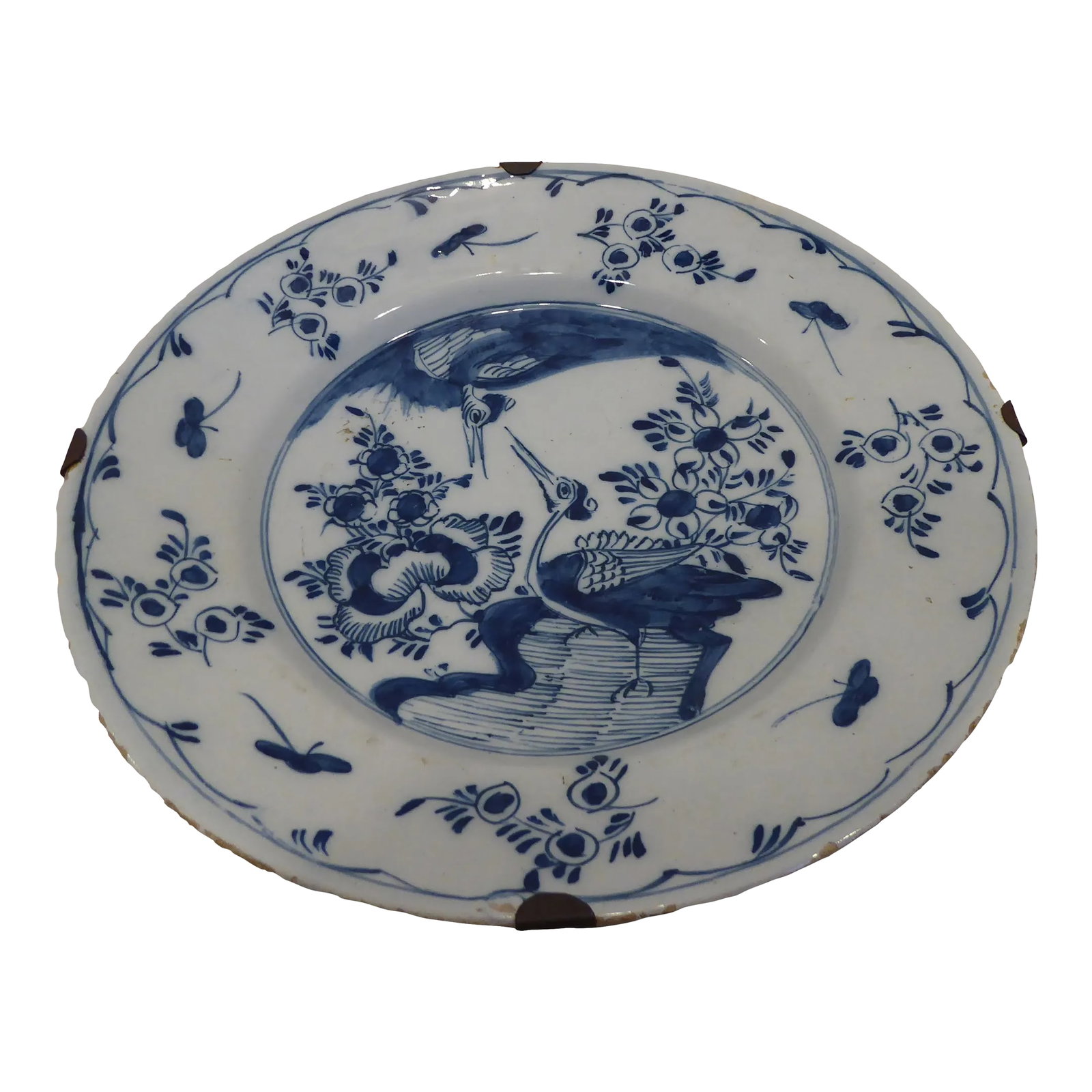 18th Century Delft Tin Glazed Plate: Delft plate with old hanger for hanging on wall, 9.25"Diameter, blue on grayish-white background. Condition: Alterations: Unknown Imperfections: Some Imperfections Condition Notes: Excellent, minor