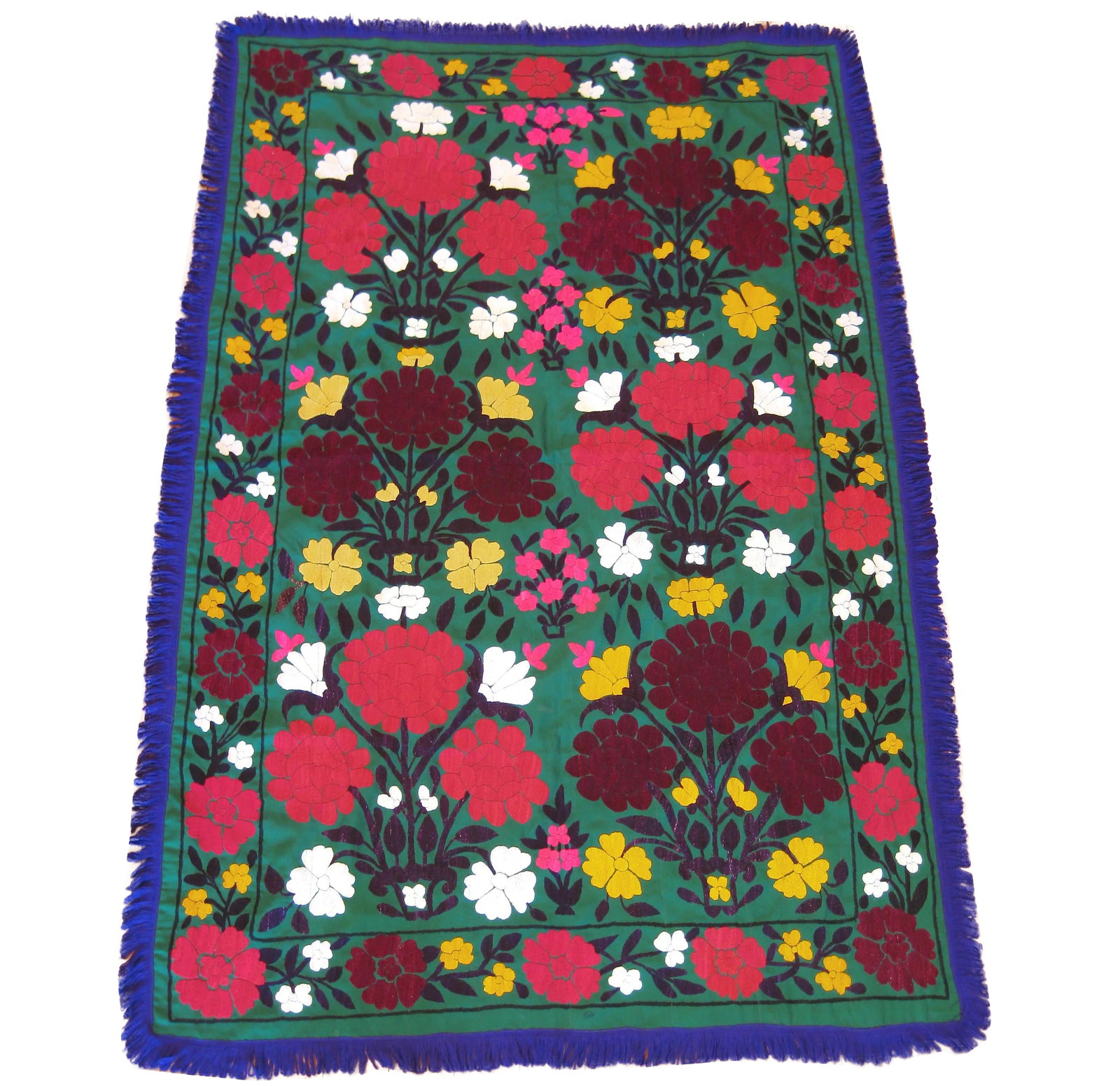 Dark Green Vintage Suzani Embroidery: Gorgeous vintage embroidered Suzani bright green wool crepe background with Large and small flowers in vibrant reds, burgundy, pink, and orange, leaves and stems are bright purple Pattern is repeated