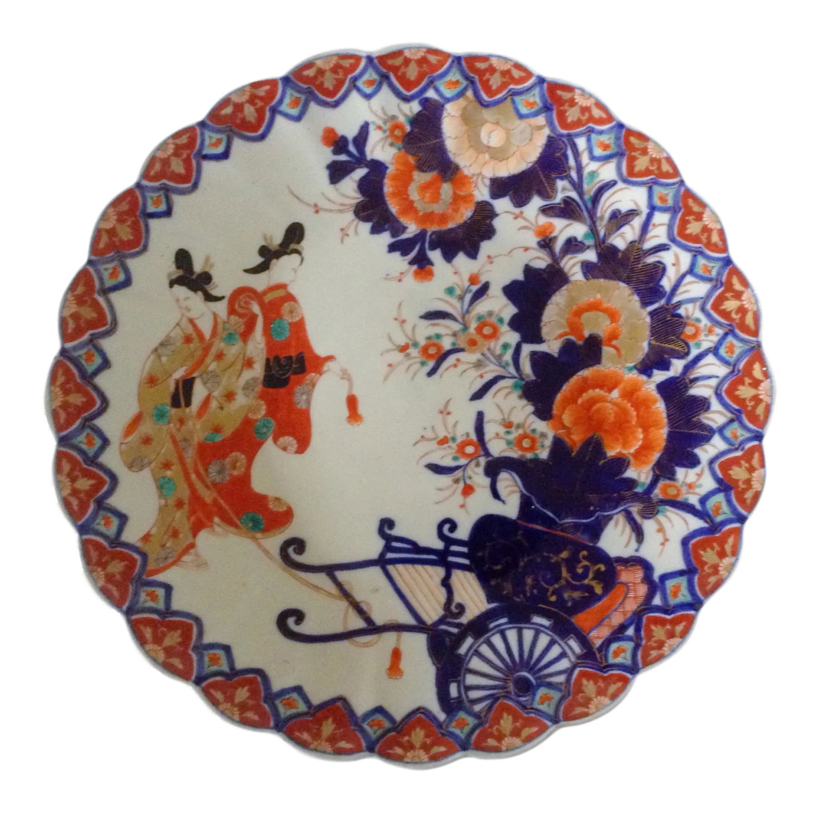 Colorful Japanese Imari Charger: This beautiful Japanese charger is a work of art displaying two women strolling in a garden of flowers in full kimono style. Lovely for display or use. Scalloped edge and traditional pattern on the
