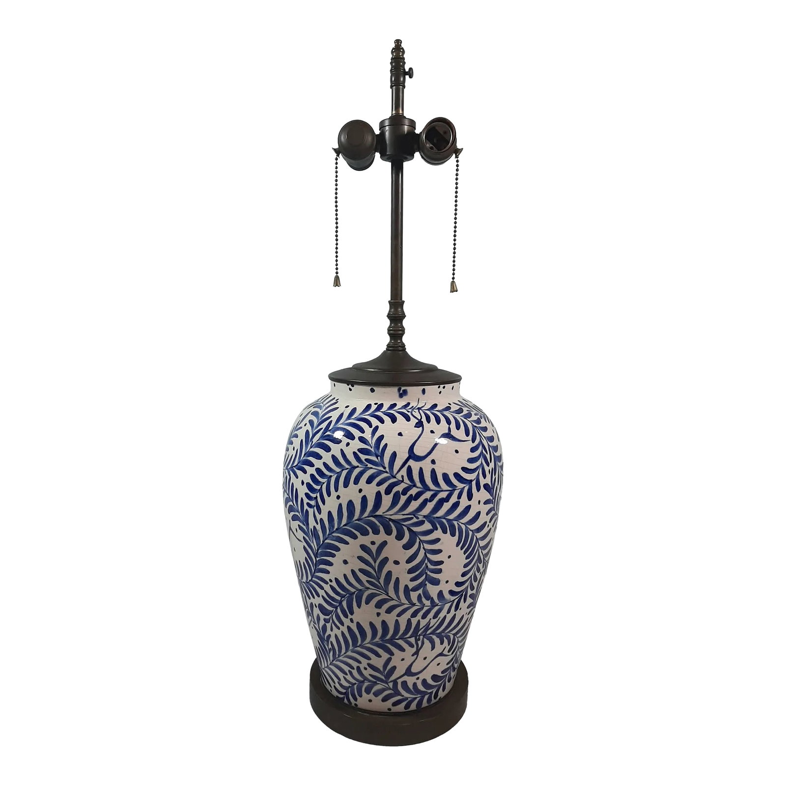 Mid 20th Century Hand Painted Flow Blue Lamp: Beautiful, hand-painted flow blue ceramic lamp. Large, ginger style vase base with bronze embossed banding on base and matching top. Has original wiring in good working condition. Double pull chain re