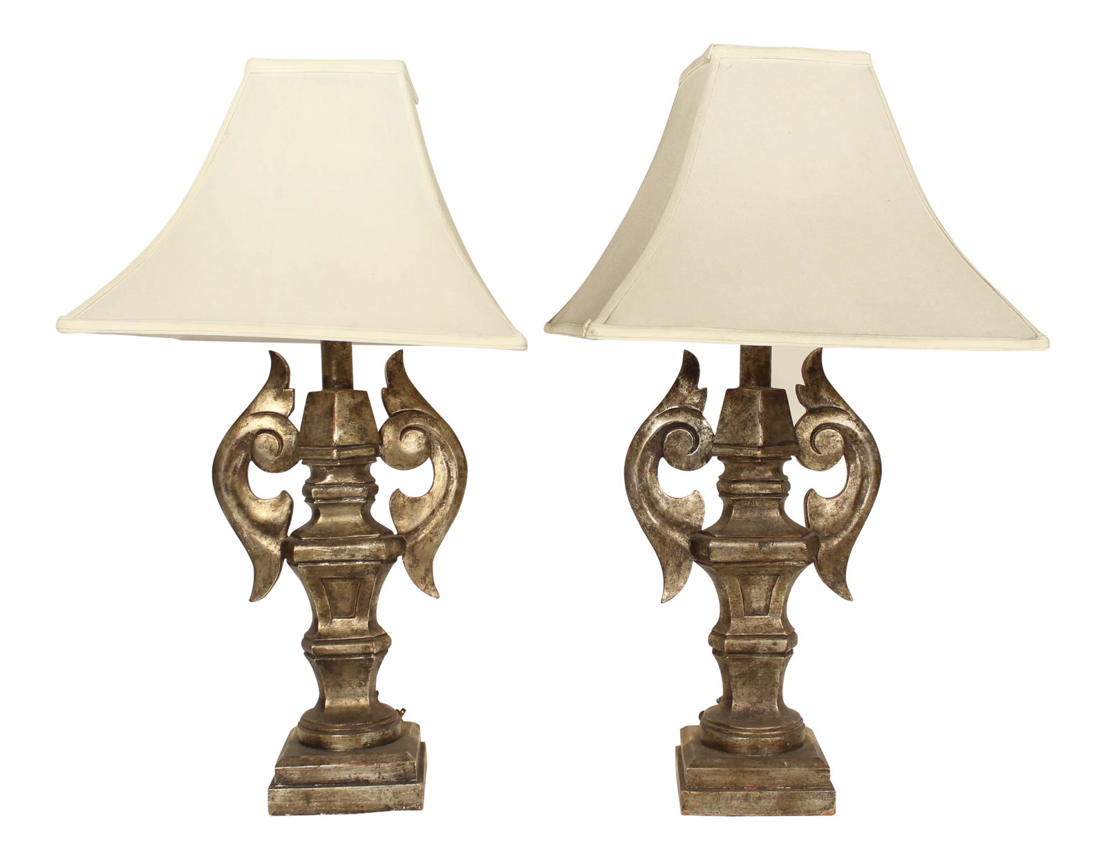 Italian Silver Leaf Table Lamps - a Pair: Pair of Italian baroque style silver leaf table lamps. Made in Italy, circa 1980. The front of the lamps are silver leaf the back side of the lamps have a gesso finish. The height from the base to