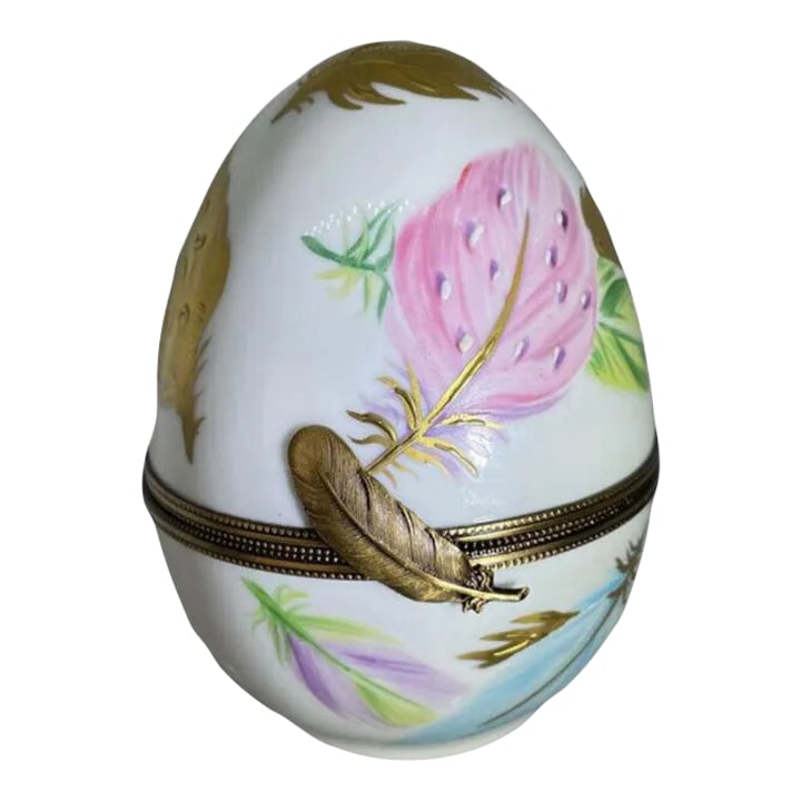 Laure Selignac Porclain Gilt & Painted Limoges Egg Trinket Box: Laure Selignac Porclain Gilt & Painted Limoges Egg Trinket Box "Four Seasons Standing Egg Limoges Box" sold at Scully & Scully. H. 4 in. x W. 3 in. x D. 1.875 in. If you would like more information, p