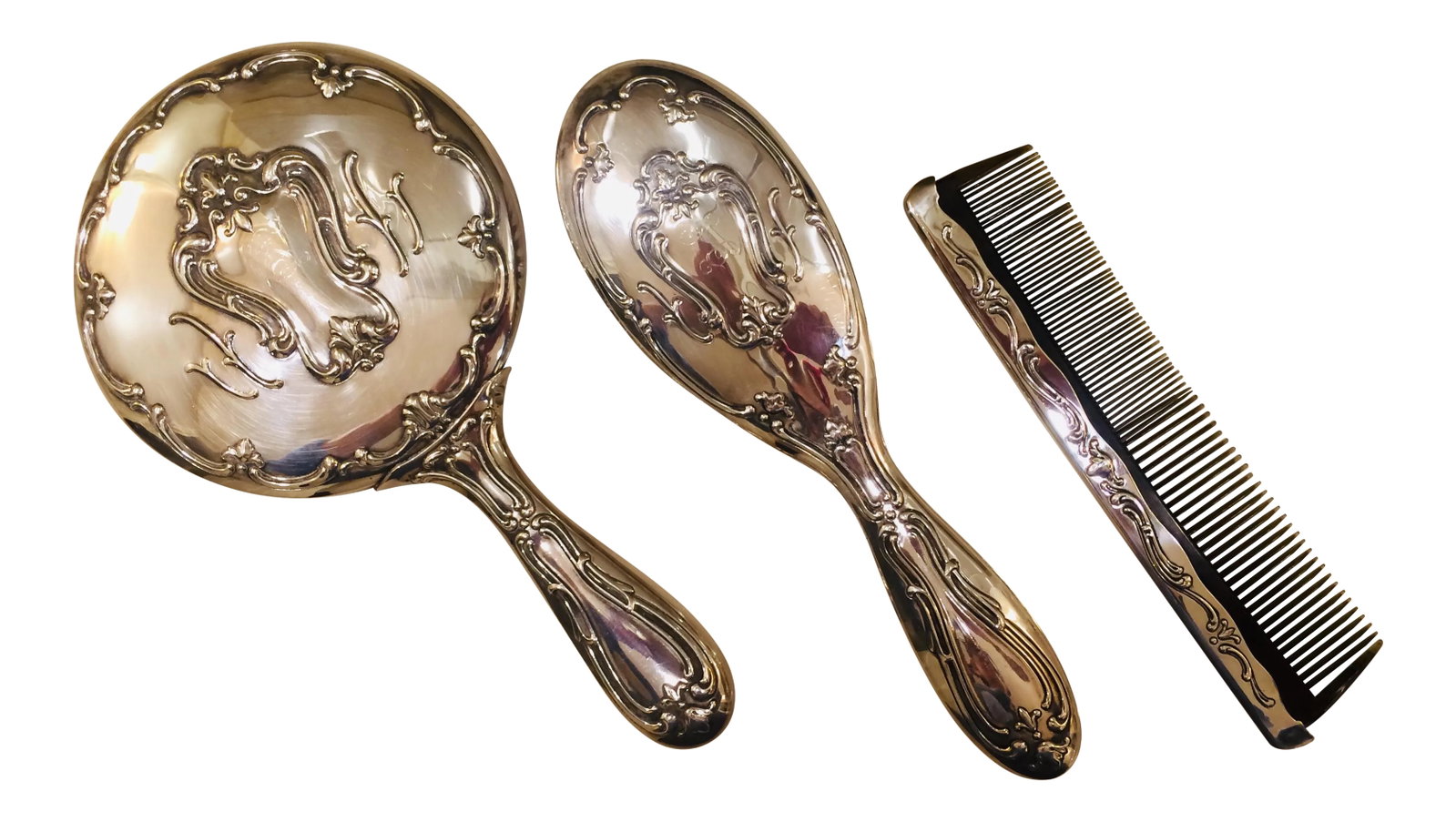 Vintage 1970's Gorham Silver Plate Mirror, Comb and Brush Vanity Set (Vintage Silver-Plate Gorham) D: This lovely vintage silver plate vanity set is lightly engraved with the initial S. It was on my mother-in-law's vanity in her home for many years. It was a beautiful addition to her powder room. The