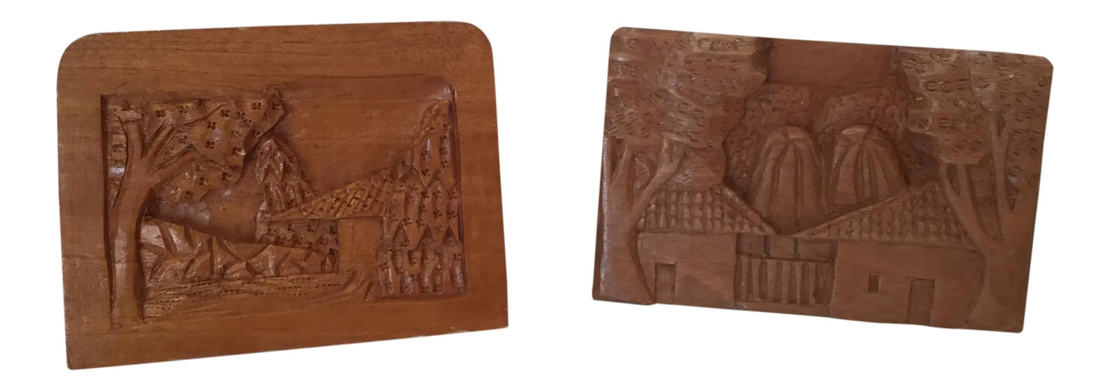 Hand Carved Wood Carvings - A Pair: A pair of hand carved wood pen holders for your desk. Each one is unique. Both show detailed scenes of a home or houses, trees, and sky on the front. The top of the piece has four holes for pens or pe