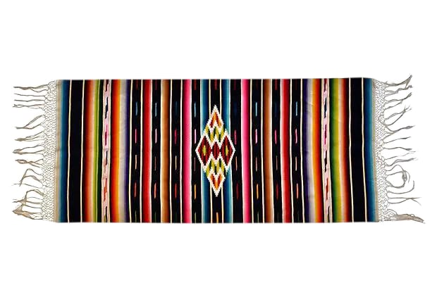 Mexican Saltillo Serape: Saltillo serape of very finely woven wool with silk in the center medallion Ojo de Dios and decorative side bars, cotton fringe, mid century. Condition: Alterations: Original Condition Unaltered Imper