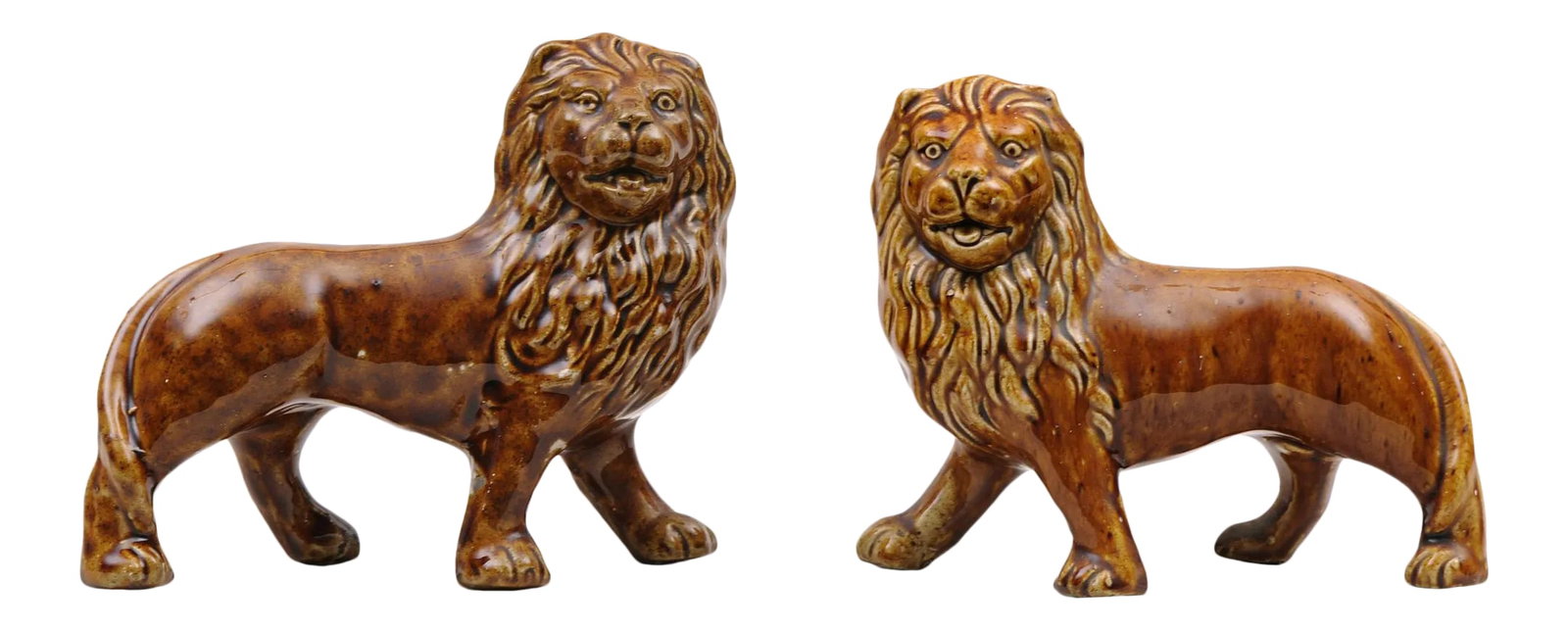 Staffordshire Treacle Lions - a Pair: Pair of Staffordshire earthenware standing lions with a treacle glaze. Condition: Alterations: Original Condition Unaltered Imperfections: Some Imperfections Condition Notes: One small area where