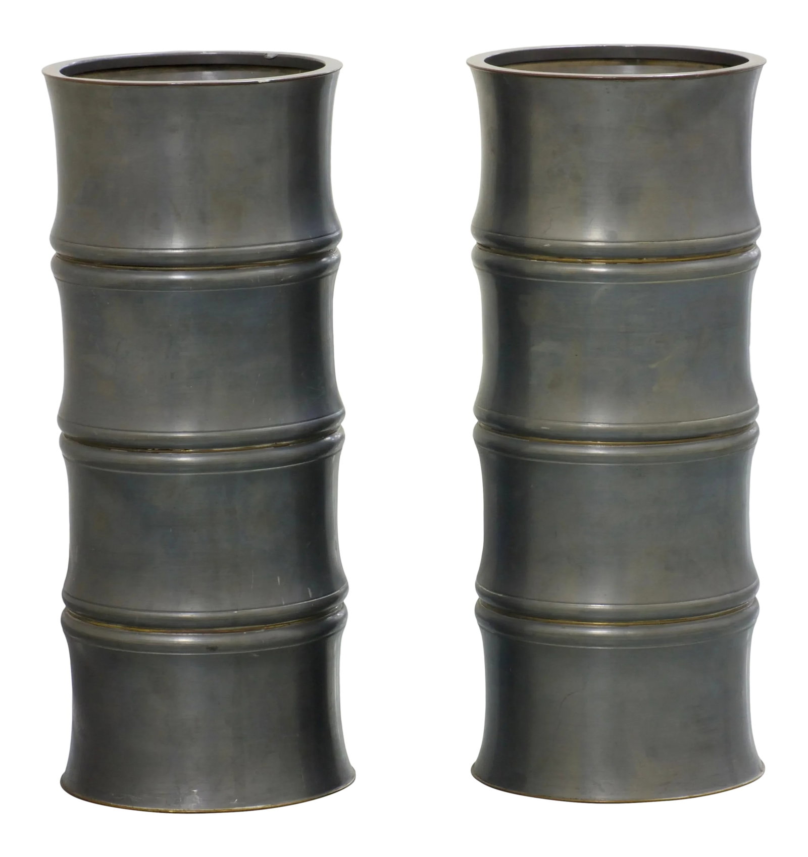 1950s Pewter Bamboo Chinoiserie Urns - a Pair: Tall and quite heavy bamboo shape pewter urns with cylindrical recessed brass details. Makers mark on bottom of urns. The pair would work well with most style of decor. Set on both sides of a large co
