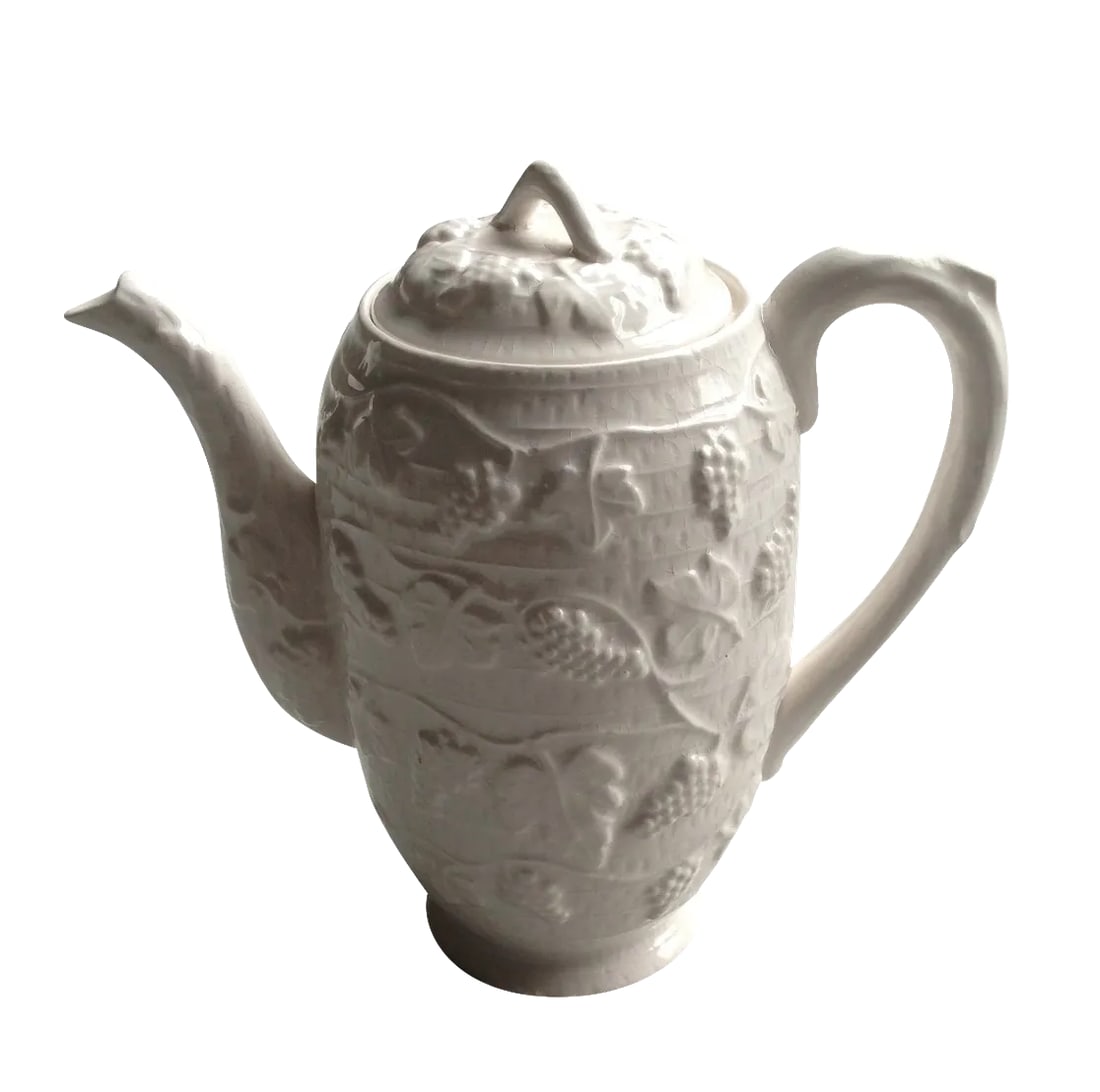 White Ceramic Tea/Coffee Pot Kettle: Vintage white ceramic tea coffee pot kettle. Features grape leaf and leaves. Pretty sure this item is made from ceramic but could also be porcelain or pottery, unknown maker. Measures: Roughly 7 1/4" 