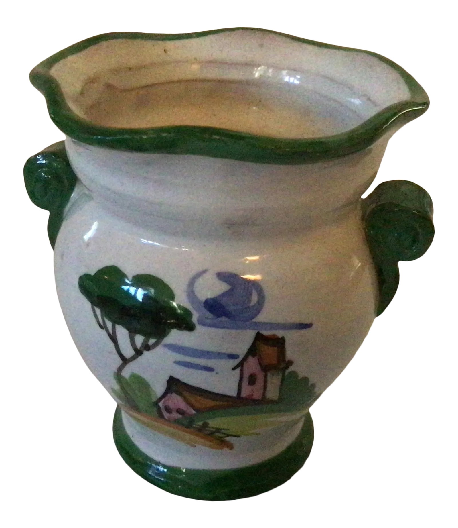 1990s Italian Hand Painted Mini Vase: 3.75" tall, 2" base, 3" mouth, 9.5" around the vase. Marked Italy 1497/164. White background urn style vase with country house scene on one side and stylized green and orange foliage on the other. Gre