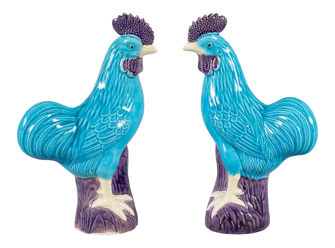 Chinese Export Porcelain Turquoise and Purple Roosters, a Pair: A pair of Chinese export porcelain roosters perched on a rocky plinth with one leg raised, the bodies glazed in turquoise, the wattle, cockscomb and rocks glazed in aubergine or purple, the feet and